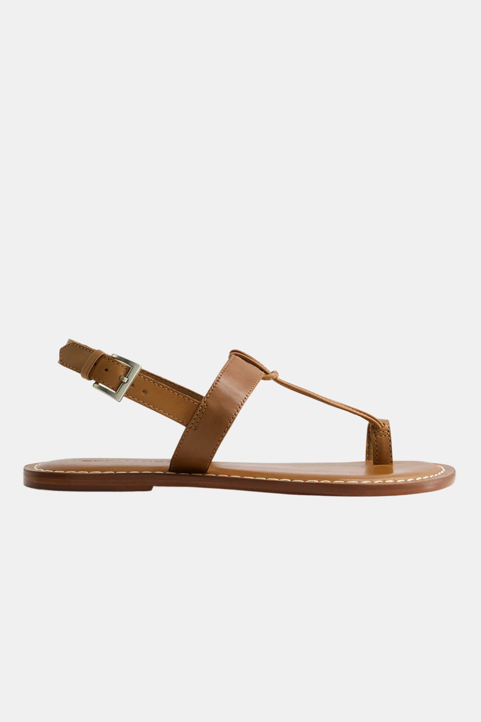 The Bernardo Maverick 2 Sandal is a brown flat sandal with a toe loop, ankle strap and silver buckle, plus visible white stitching on the sole, displayed on a plain white background.