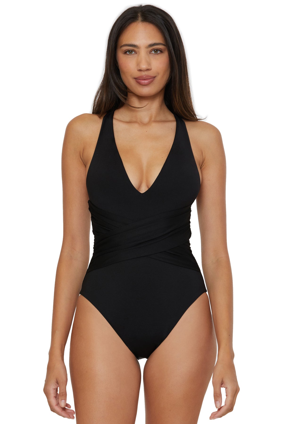 A woman with long dark hair wears the Monaco Wrap Front Plunge One-Piece Swimsuit in black, featuring a deep V-neckline and crisscross waist detail, standing against a white background.