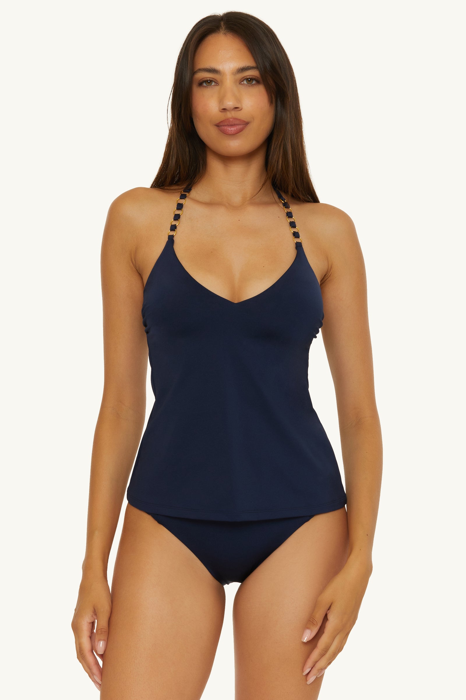 A woman wearing the Ink Ring Tankini Swim Top - Monaco with beaded straps and matching bikini bottoms stands facing forward against a plain light background.