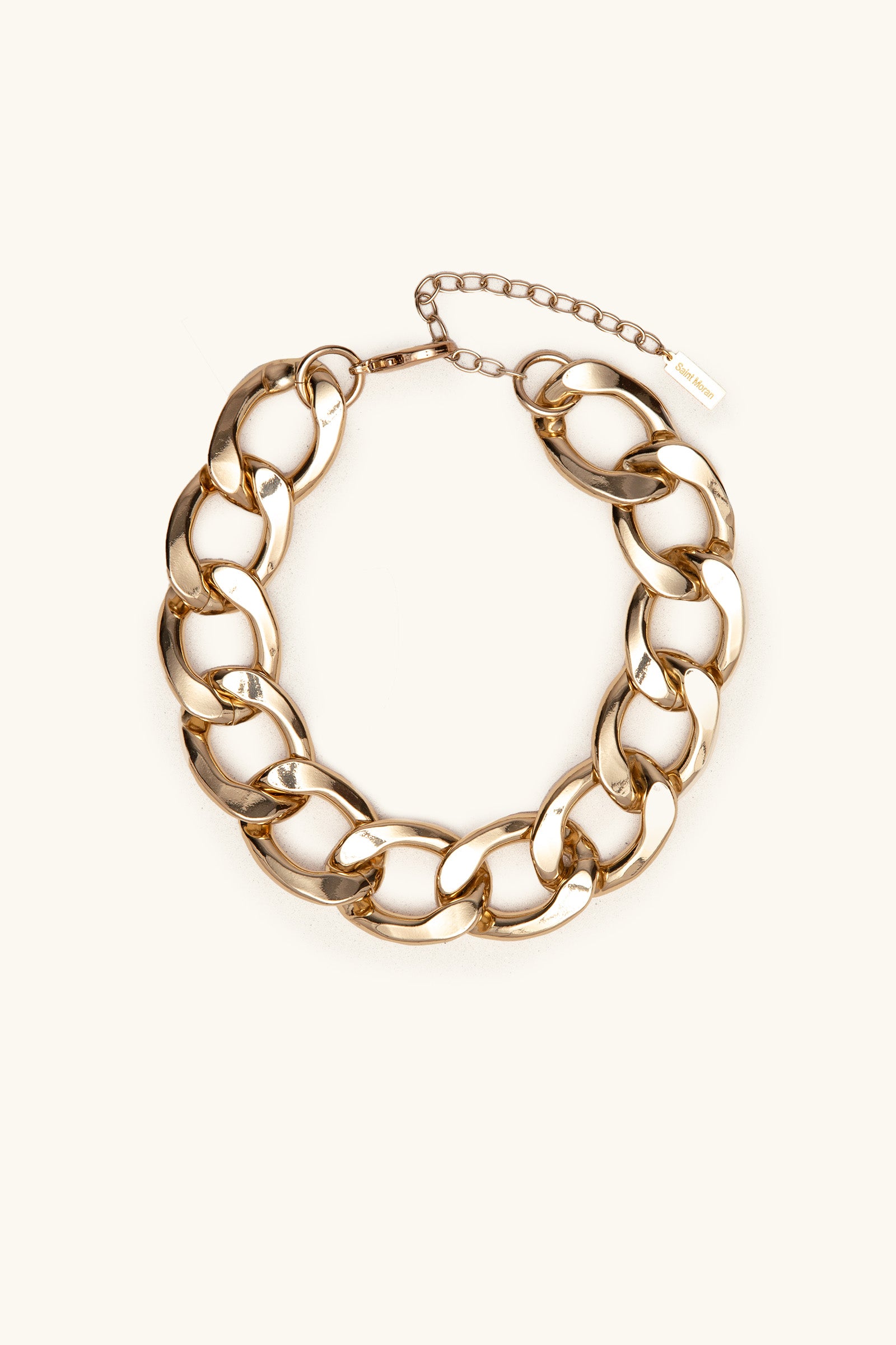 The Azlin Chain Necklace features chunky gold oval links and an adjustable clasp, shown on a plain light background.