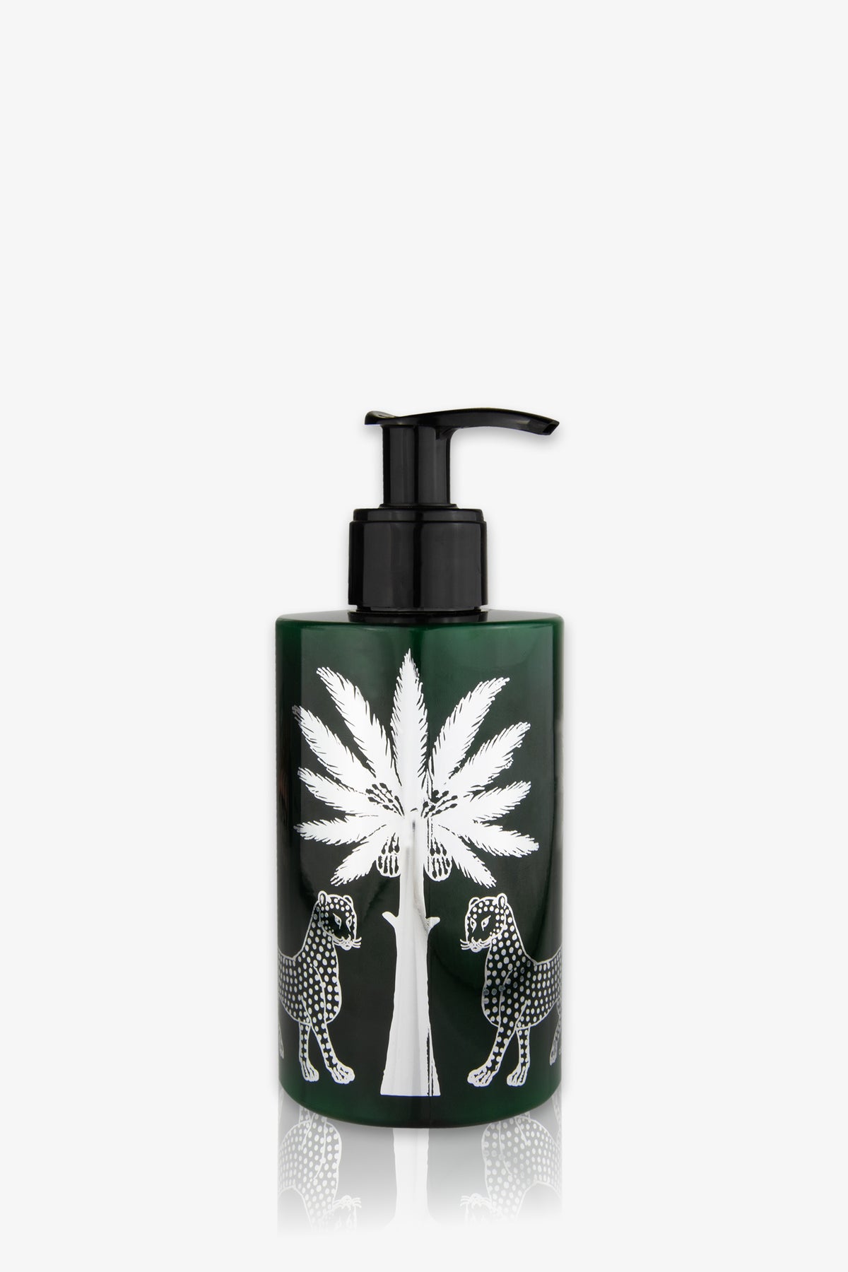 An amber pump bottle of Ortigia Ambra Nera Lotion, featuring a white illustration of a palm tree with two leopards facing each other, one on each side. The background is plain white.