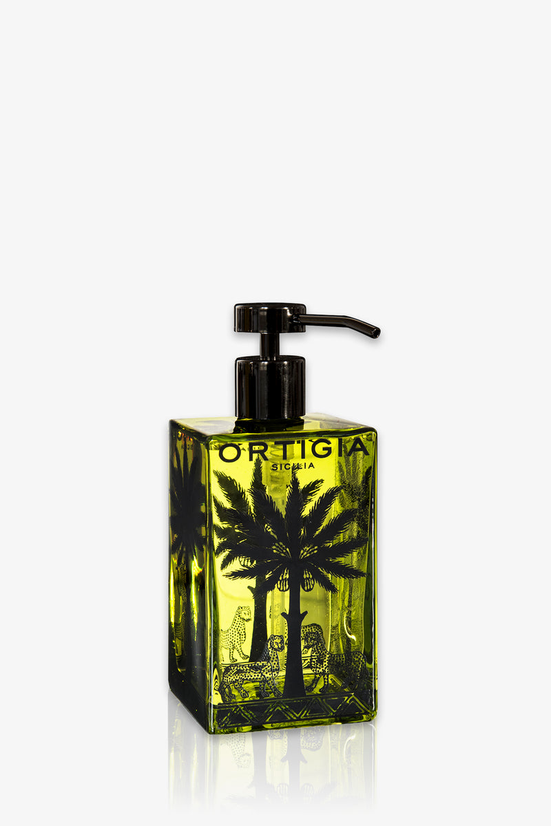 A square transparent bottle of green Ortigia Fico D'India Glass Soap with black palm tree illustrations and a black pump dispenser. The label reads “Ortigia Sicilia.”.