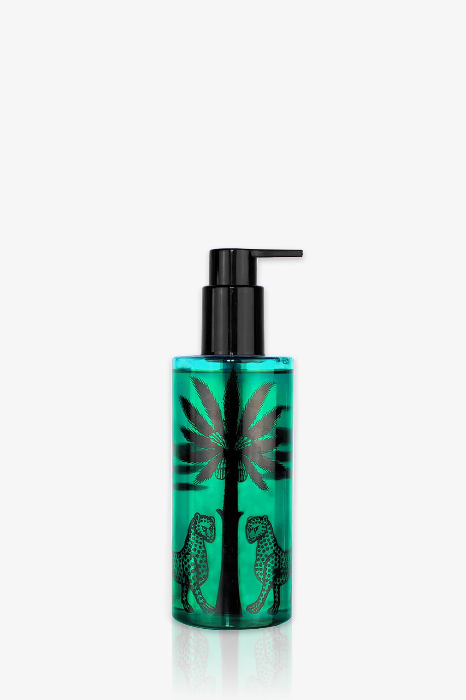 A blue pump bottle of Ortigia Sandalo Shower Gel features a black leaf design, possibly palm or cannabis, with two spotted leopards facing each other at the base.