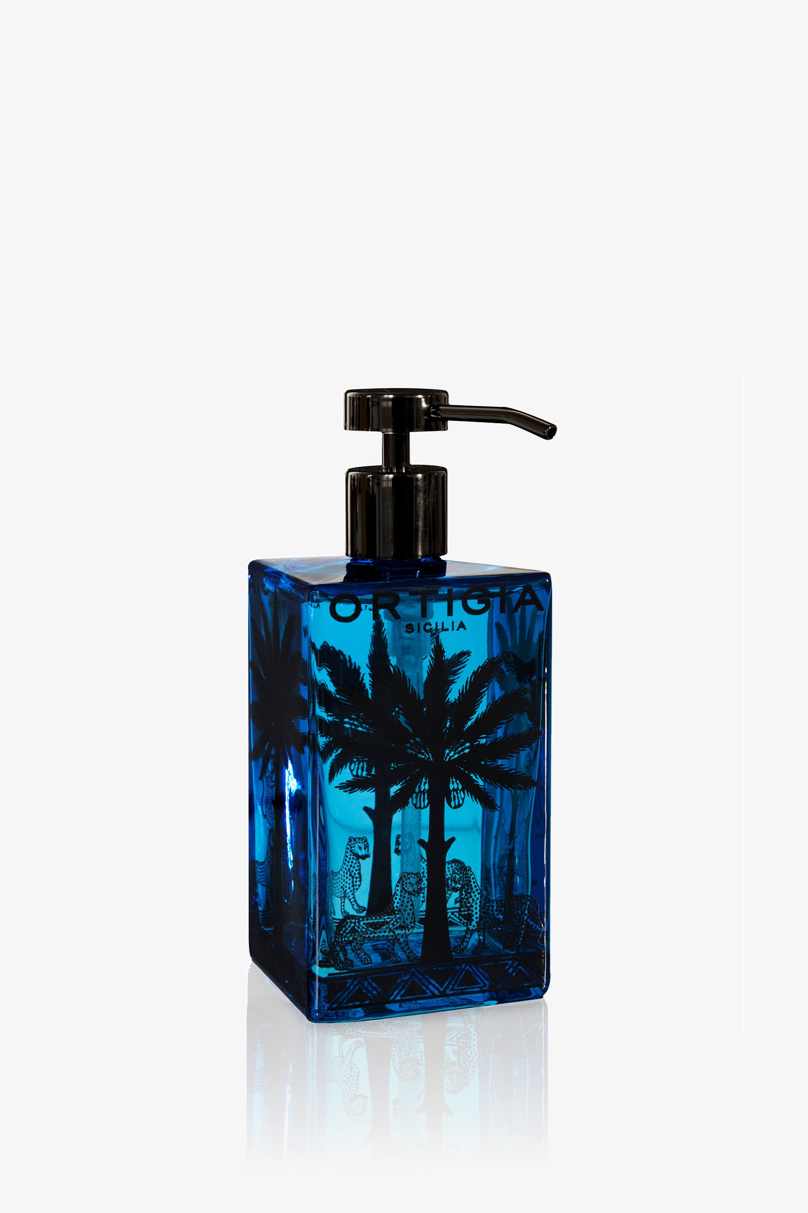 A blue rectangular Ortigia Florio Glass Hand Soap dispenser with a black pump, decorated with palm trees and leopards, labeled ORTIGIA SICILIA.
