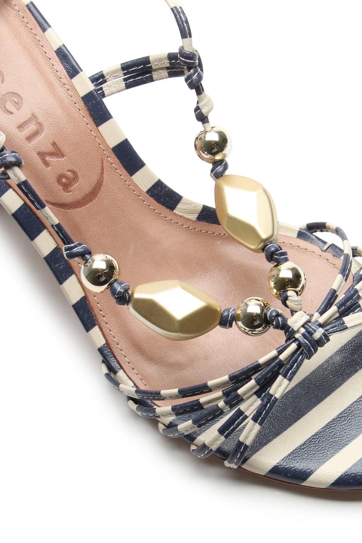 Close-up of the Mantua Block Heel Sandal featuring navy blue and white stripes, gold and metallic bead accents, and a tan insole with a partially visible brand name.
