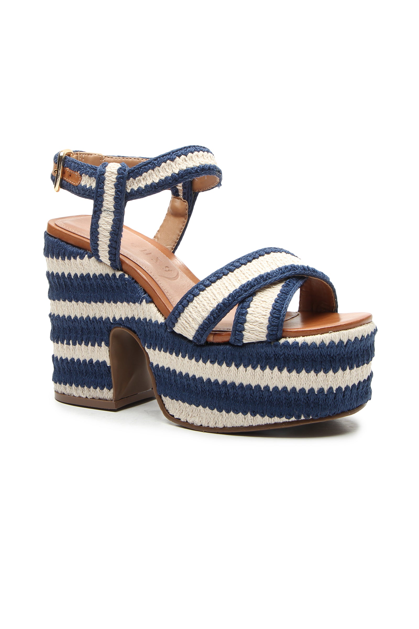 The Zamzibar Platform is a blue and white striped sandal with crisscross straps, an open toe, ankle strap, chunky heel, woven texture, and a buckle closure.