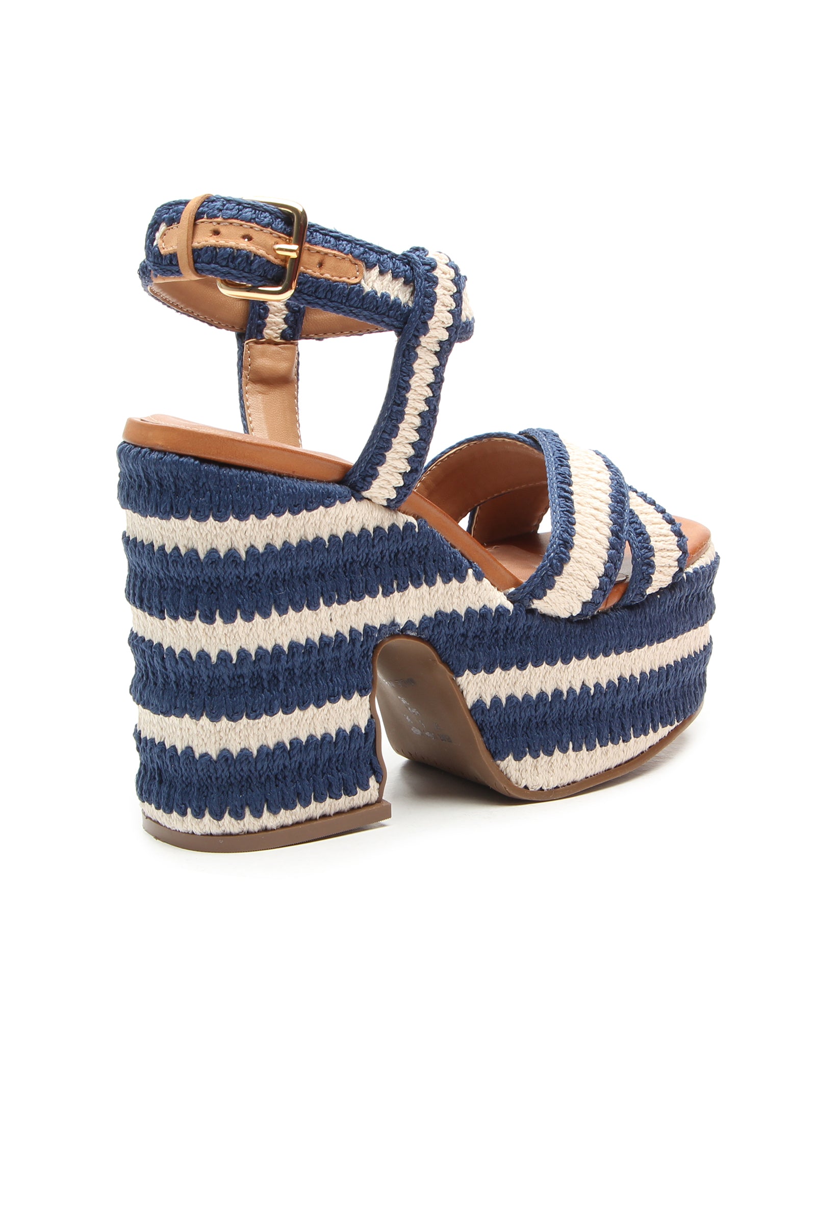 The Zamzibar Platform is a high-heeled sandal with thick blue and white striped woven straps and sole, a gold-buckled ankle strap, and tan interior lining.
