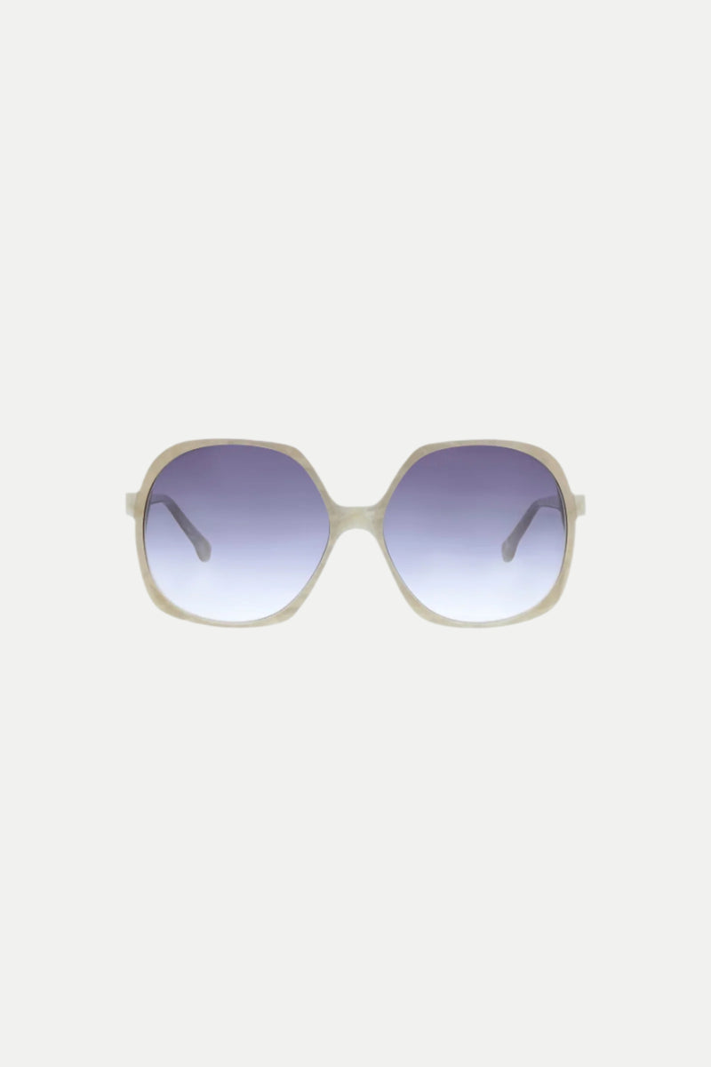 The Paradis Oversized Square Acetate Sunglasses in Pearl feature a light-colored frame and dark gradient lenses, showcased against a plain white background.