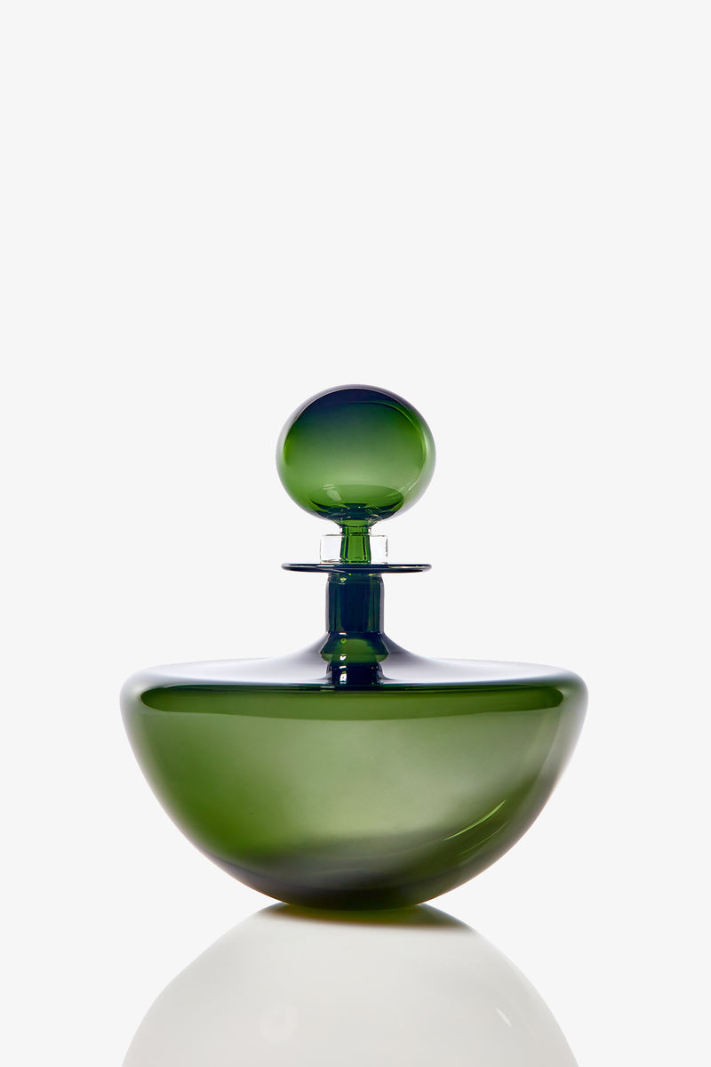 The Small Angelic Bottle is a green glass perfume bottle with a round stopper, smooth glossy surface, and an elegant rounded shape, photographed against a white background.