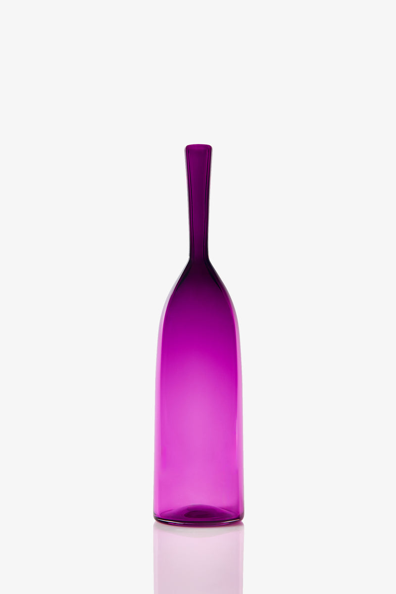 A Small Angelic Bottle with a tall, slender shape, purple glass, narrow neck, and smooth surface stands upright on a white background.