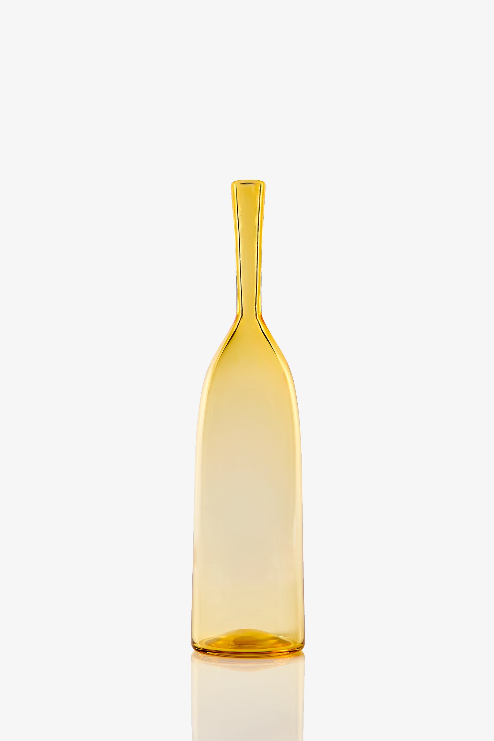 The Small Angelic Bottle is a tall, slender, translucent amber glass bottle with a narrow neck and slightly flared base, shown upright on a white background.