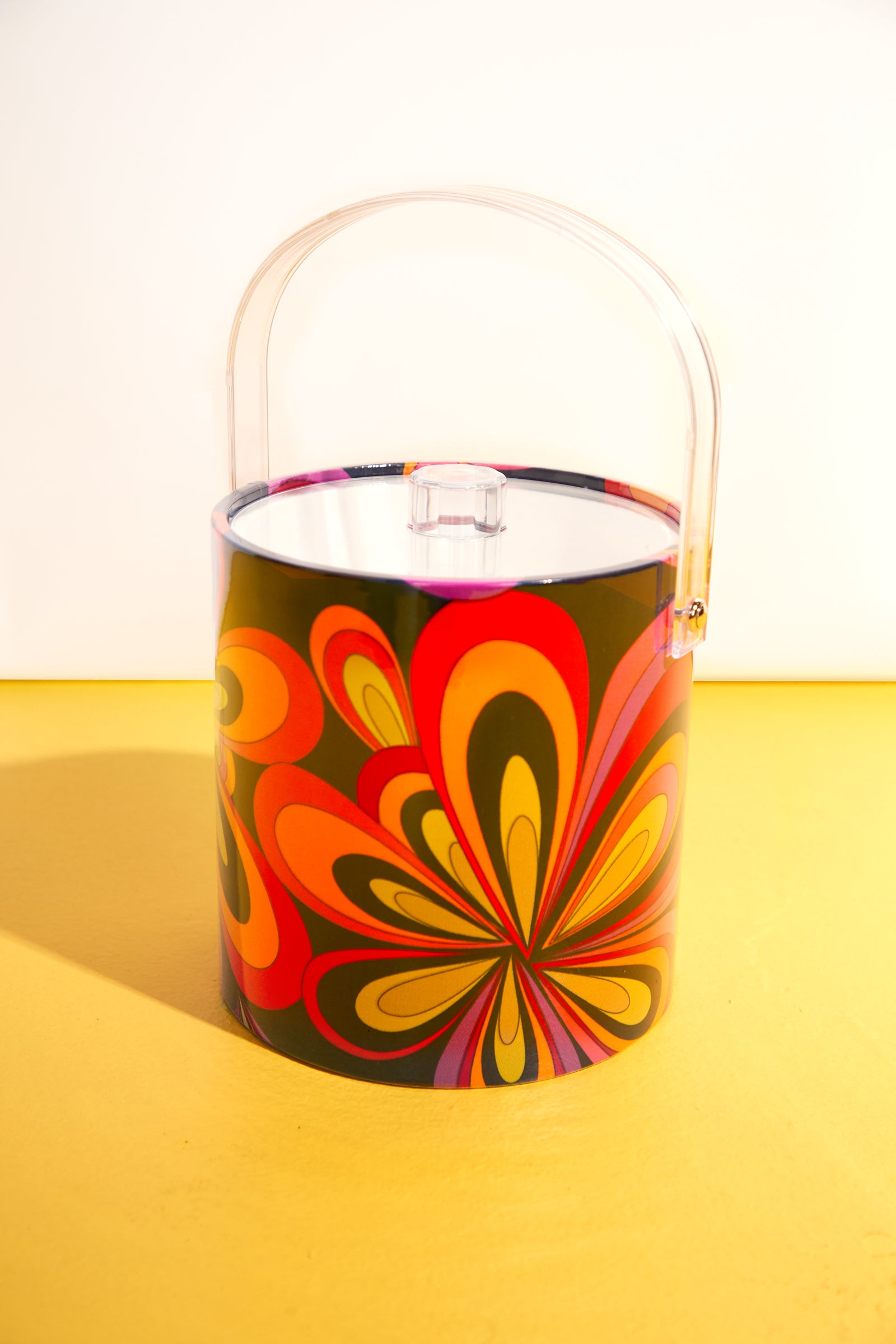 The Trina Turk Boca Blooms Print Ice Bucket in multi features a vibrant, retro-inspired pattern and clear handle—making it the perfect accessory for any bar cart or vintage-themed space.