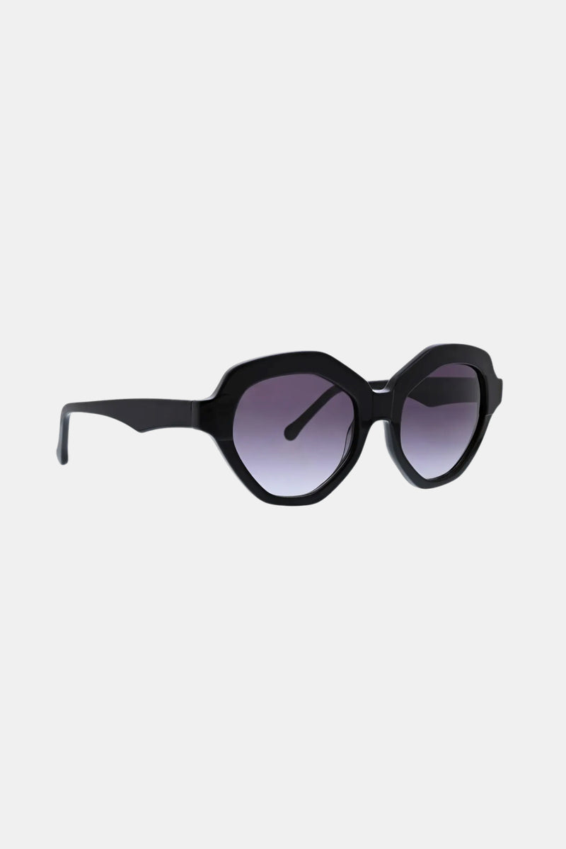 The Ipanema Sunglasses feature black geometric frames with thick borders and dark gradient lenses, displayed against a plain white background.