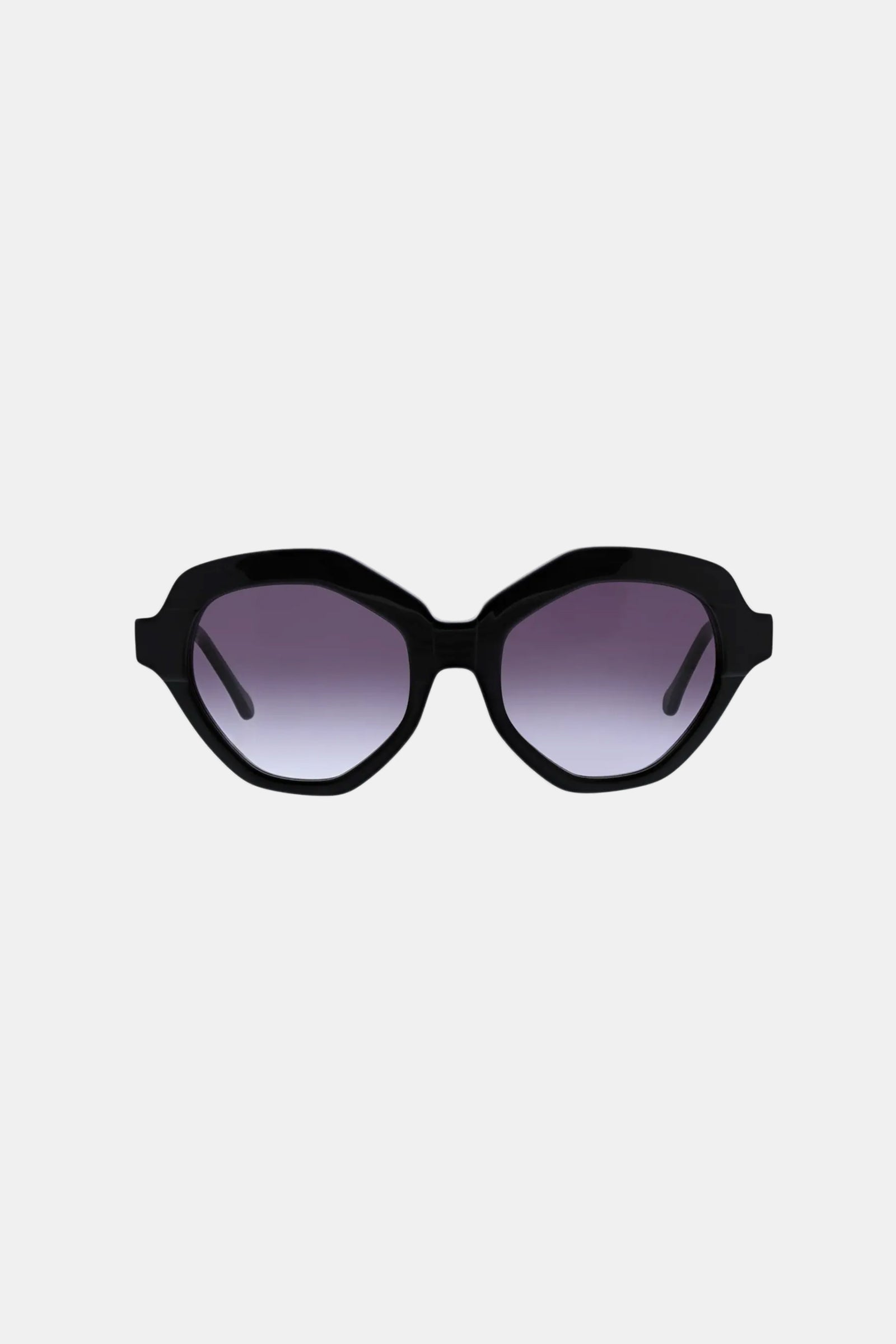 The Ipanema Sunglasses feature a black frame and oval-shaped dark gradient lenses, showcased against a plain light gray background.