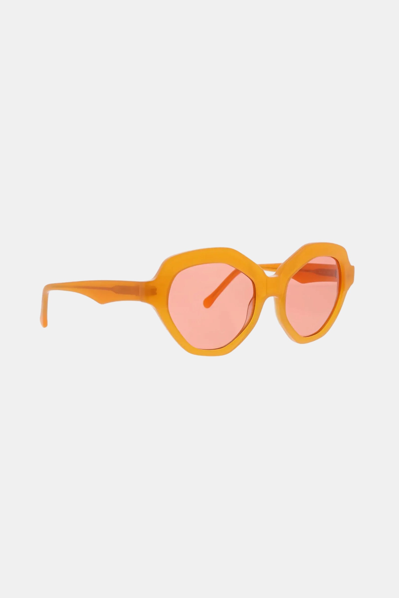 Ipanema Sunglasses with orange frames, geometric rounded edges, and pink-tinted lenses displayed on a white background.