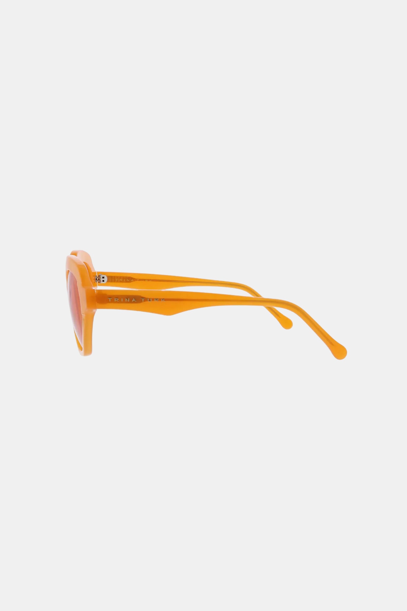 Side view of Ipanema Sunglasses featuring thick orange frames and matching arms, displayed against a plain white background.