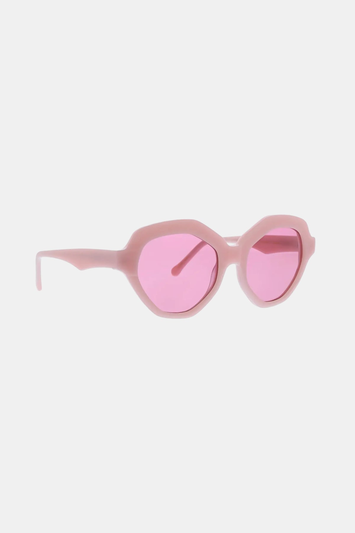 Ipanema Sunglasses with thick, geometric pink frames and matching tinted lenses, shown on a white background.
