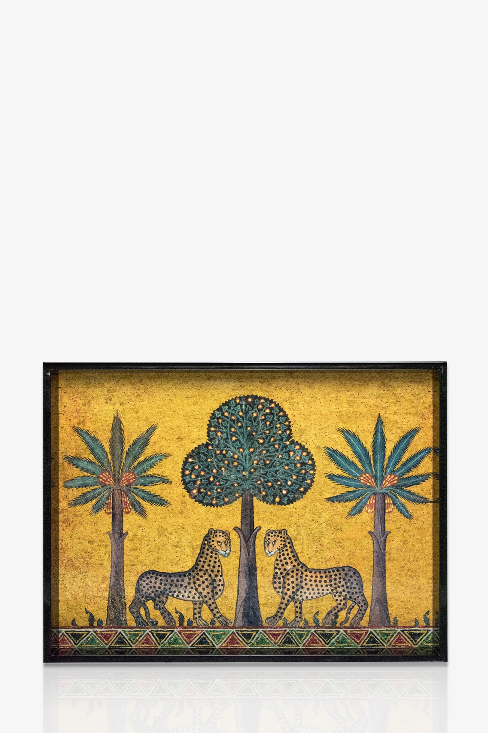 The Ortigia Medium Tray is a rectangular piece featuring two leopards facing a central tree, flanked by palm trees, on a yellow background with detailed decorative patterns along the bottom.
