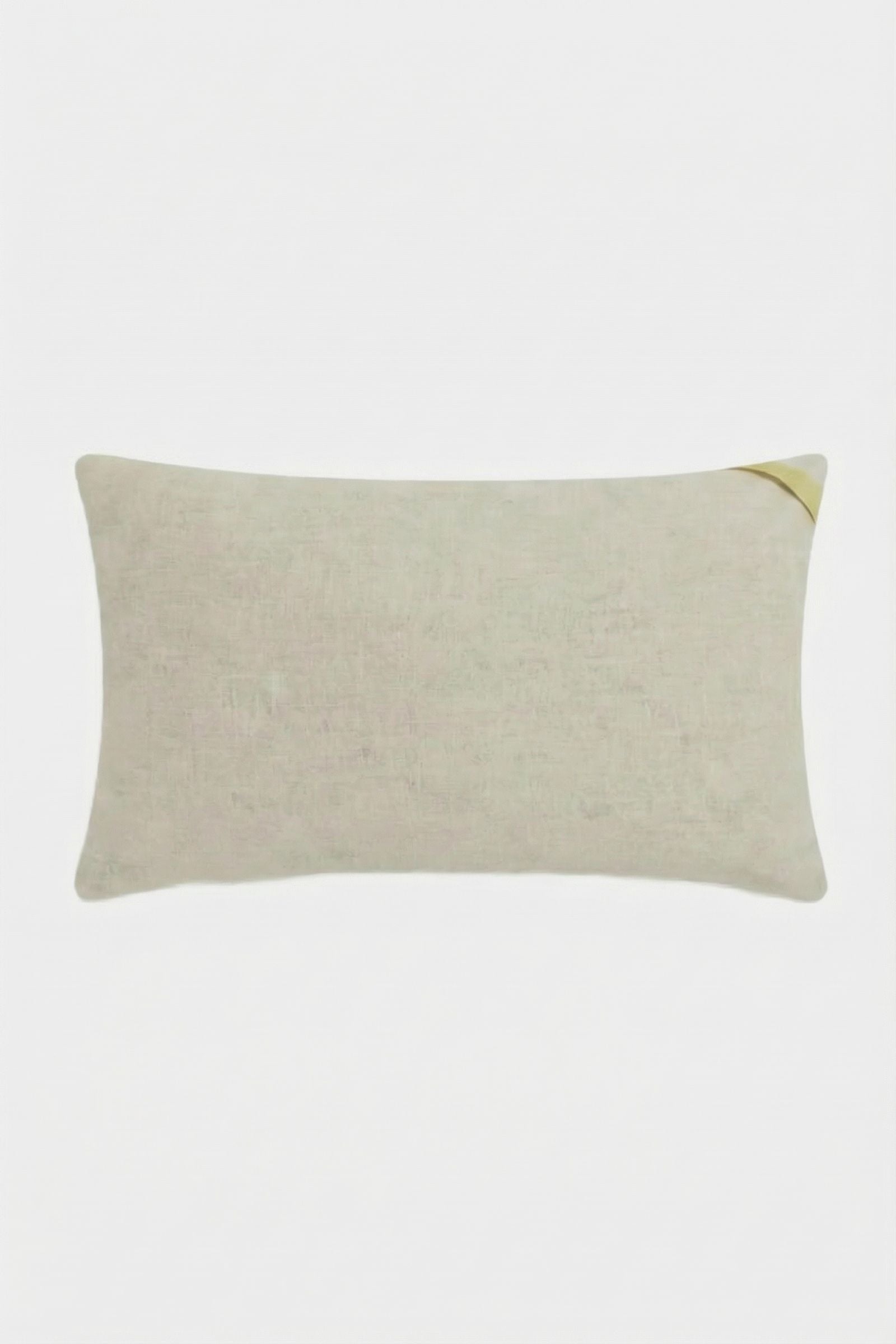 The Santorini White Tufted Throw Pillow 12"X24" is a rectangular pillow with a subtle texture and a small gold diagonal accent on one corner, displayed against a plain white background.