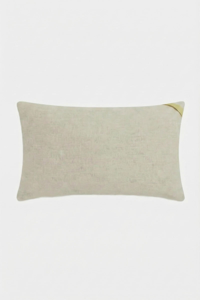 The Santorini White Tufted Throw Pillow 12"X24" is a rectangular pillow with a subtle texture and a small gold diagonal accent on one corner, displayed against a plain white background.