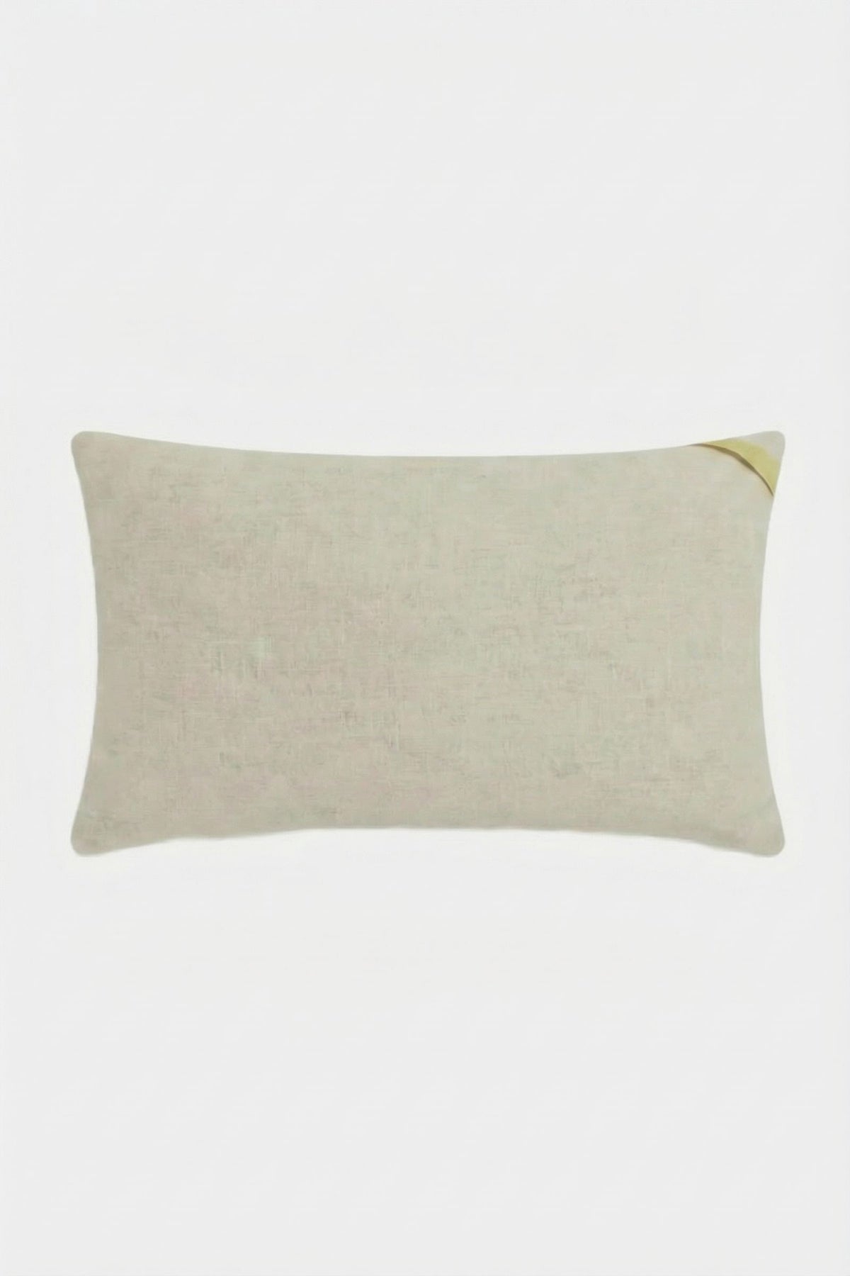 The Amazing Maze Embroidered Pillow is a rectangular, light beige pillow with a subtle texture and a small gold accent on the top right corner, shown against a plain white background.