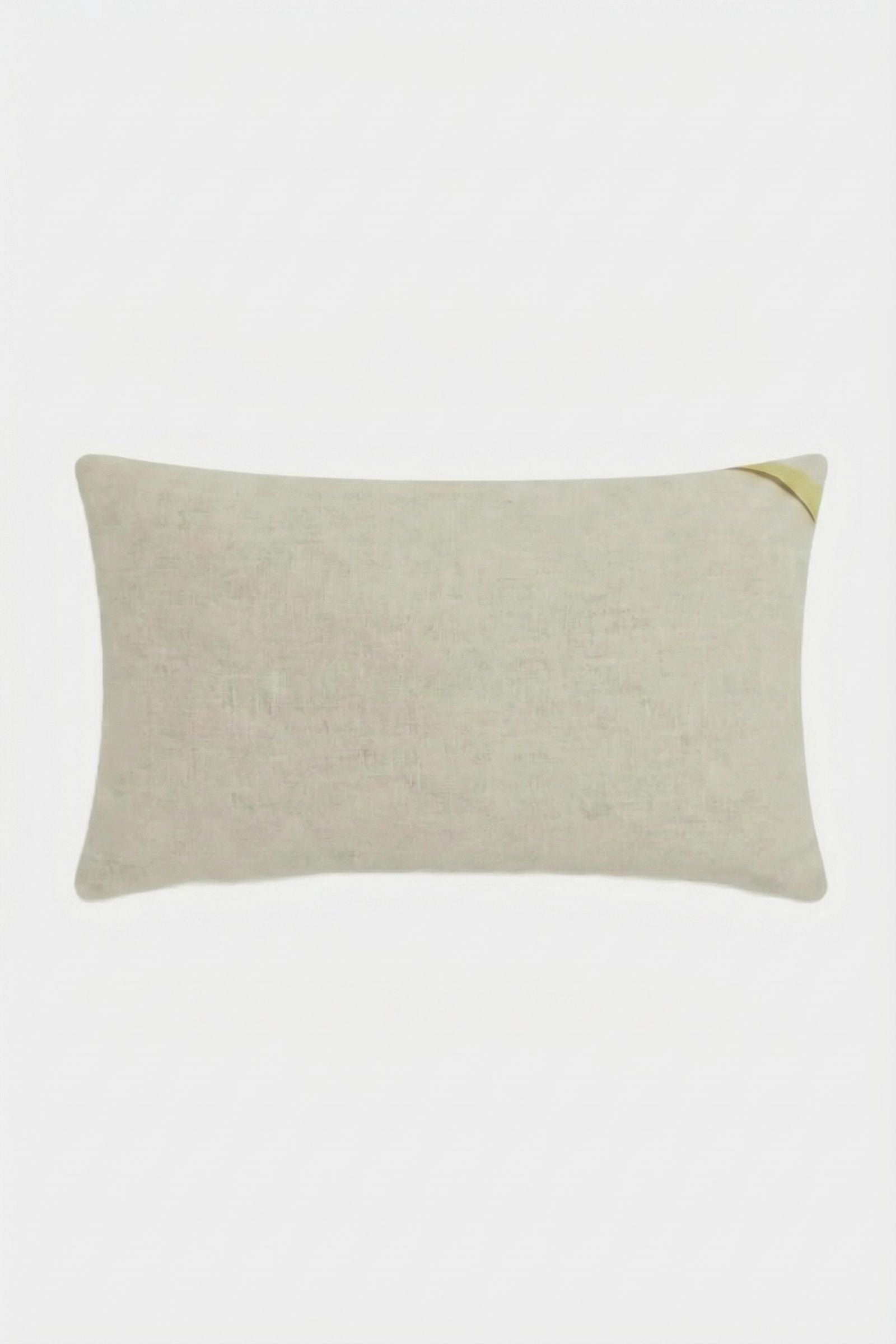 The Amazing Maze Embroidered Pillow is a rectangular, light beige pillow with a subtle texture and a small gold accent on the top right corner, shown against a plain white background.