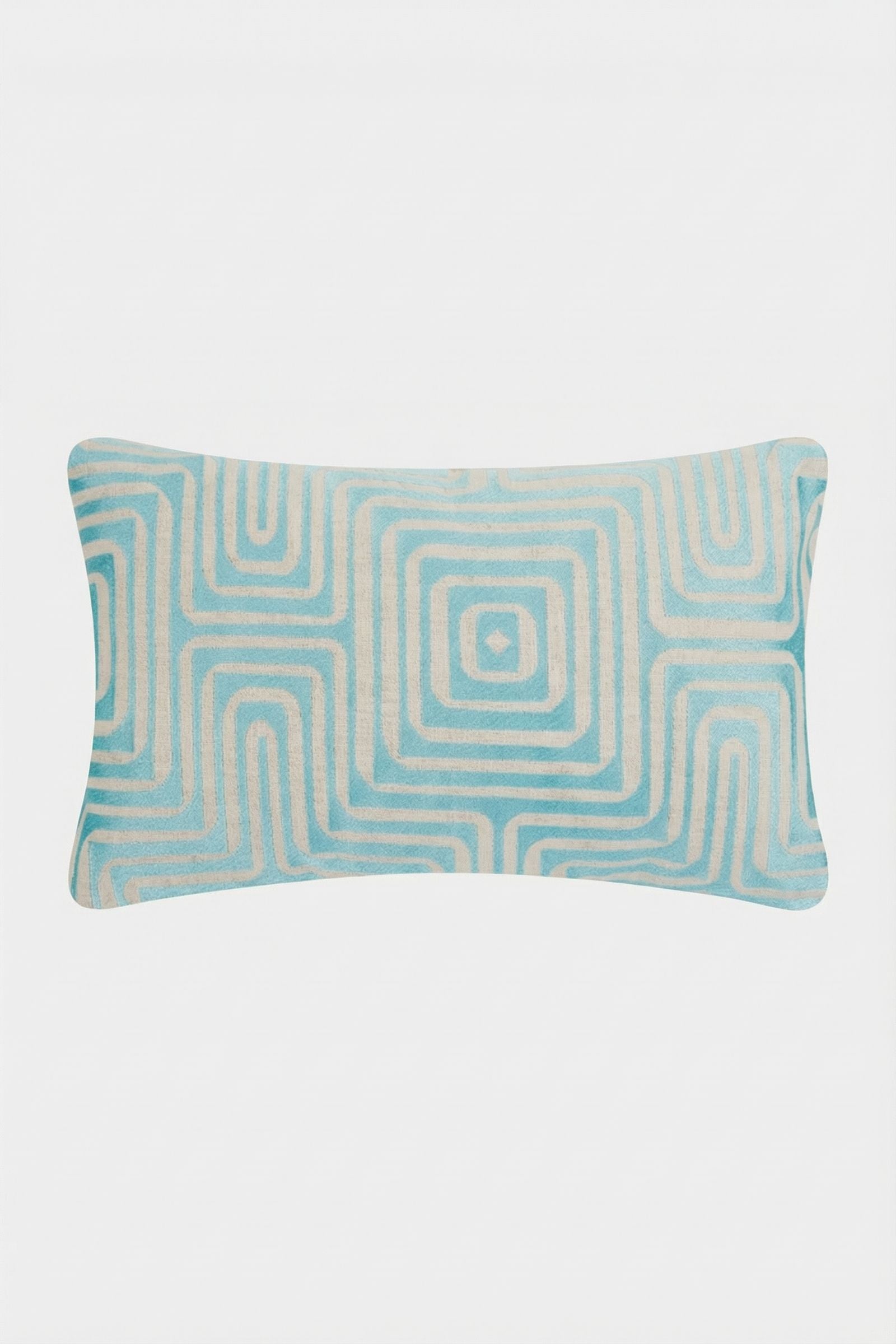 The Amazing Maze Embroidered Pillow features a geometric, maze-like pattern in blue and white with concentric squares on a plain white background.