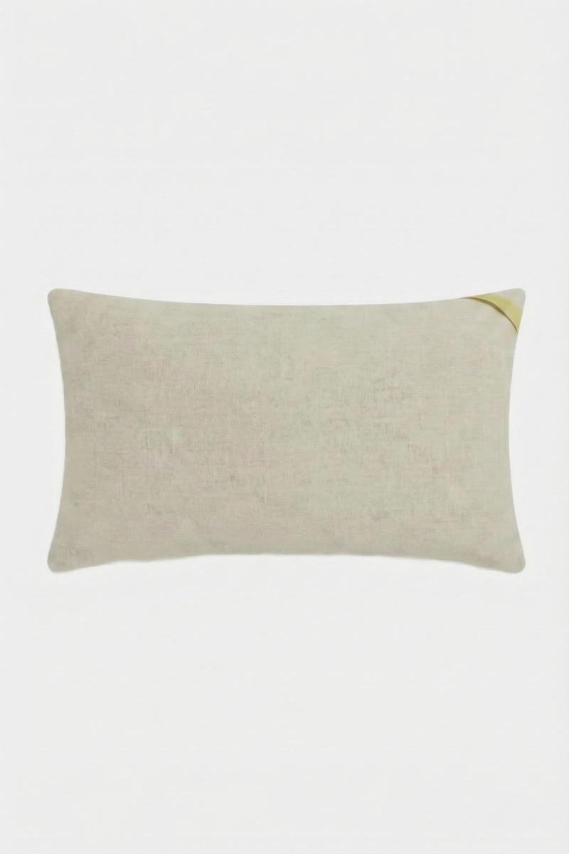 The Amazing Maze Embroidered Pillow is a rectangular beige pillow with a subtle fabric texture and a small gold accent in the top right corner, displayed on a plain white background.