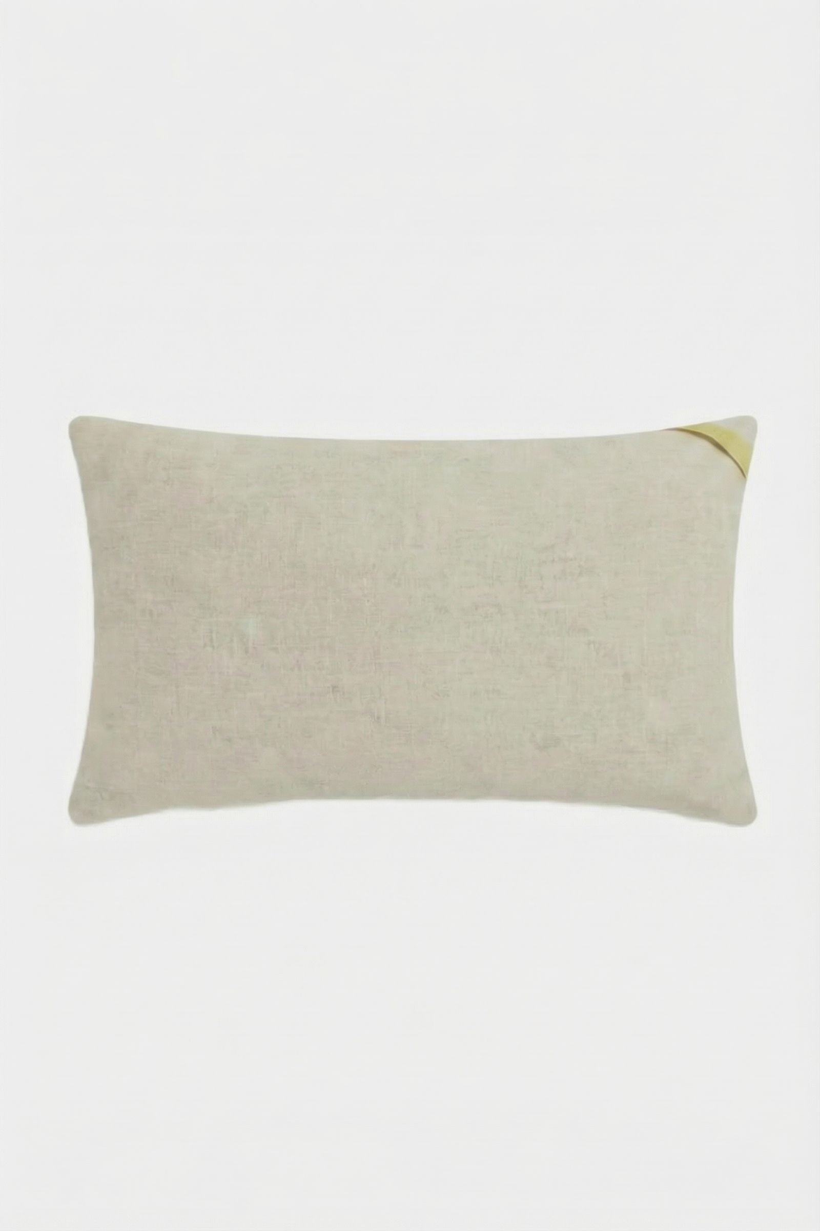 The Amazing Maze Embroidered Pillow is a rectangular beige pillow with a subtle fabric texture and a small gold accent in the top right corner, displayed on a plain white background.