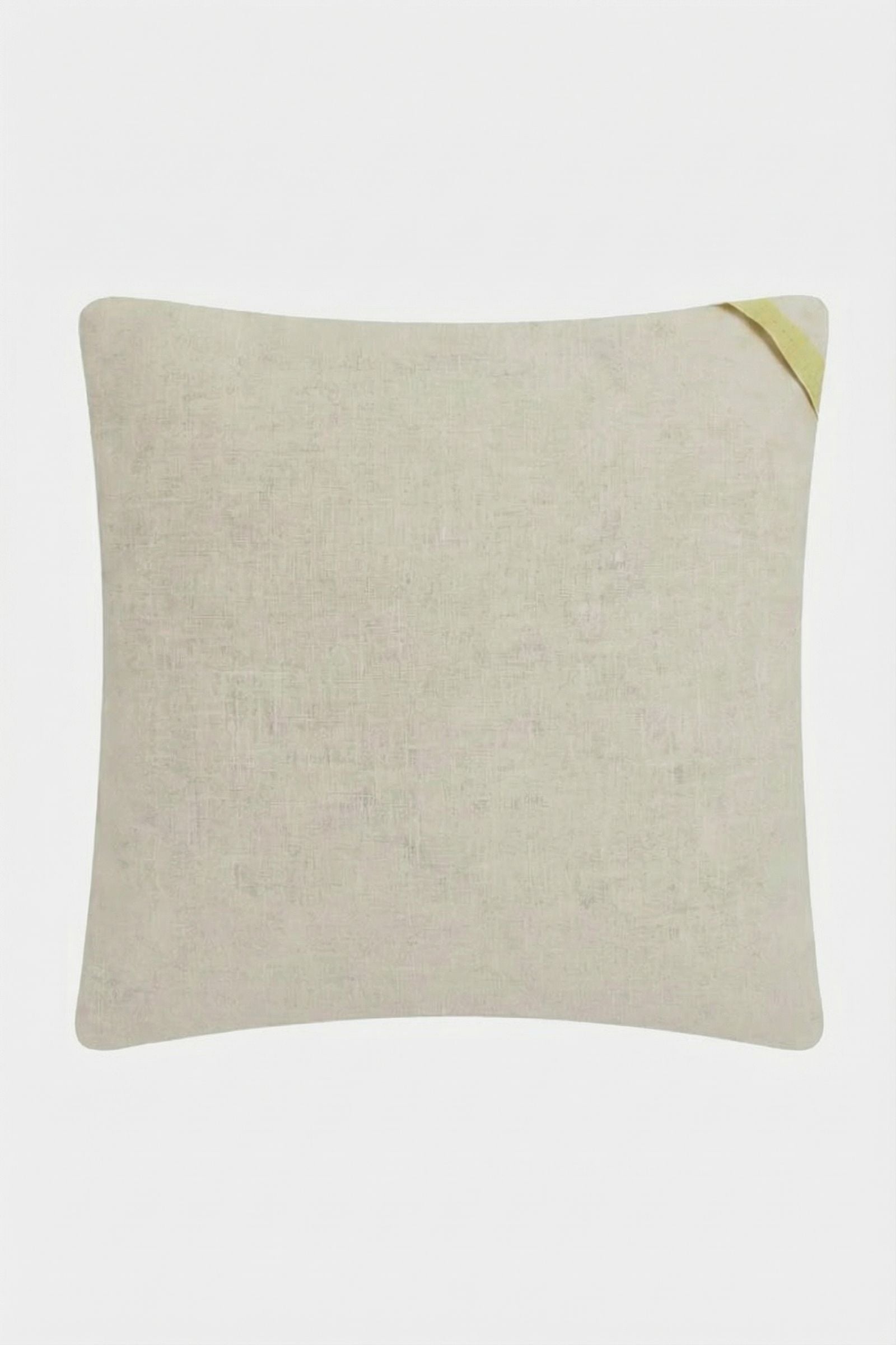 The Palm Springs Block Embroidered Pillow is a square, light beige 20"x20" cover with a subtle fabric texture and a small yellow loop on one corner, shown against a plain white background.