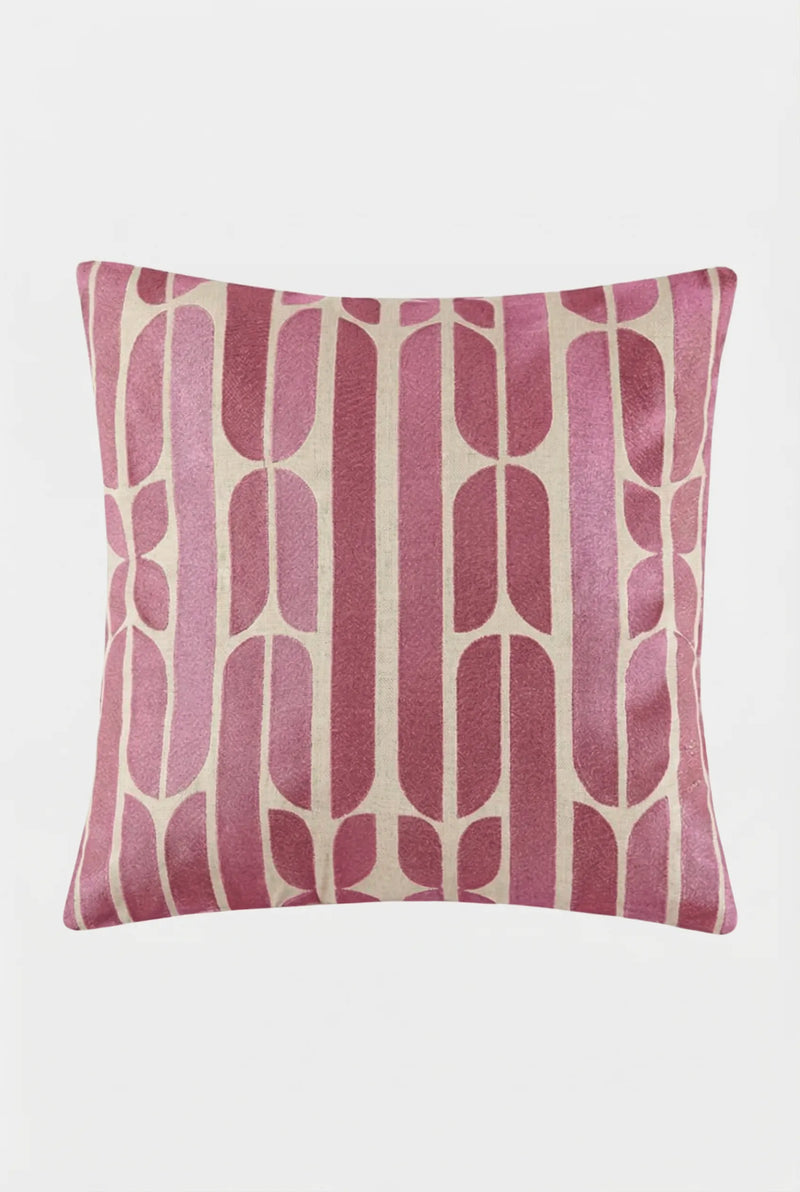 The Palmdale Emb Pillow 20X20" features a modern geometric stripe pattern in pink and beige, showcasing vertical and curved shapes on smooth fabric with a plain white background.