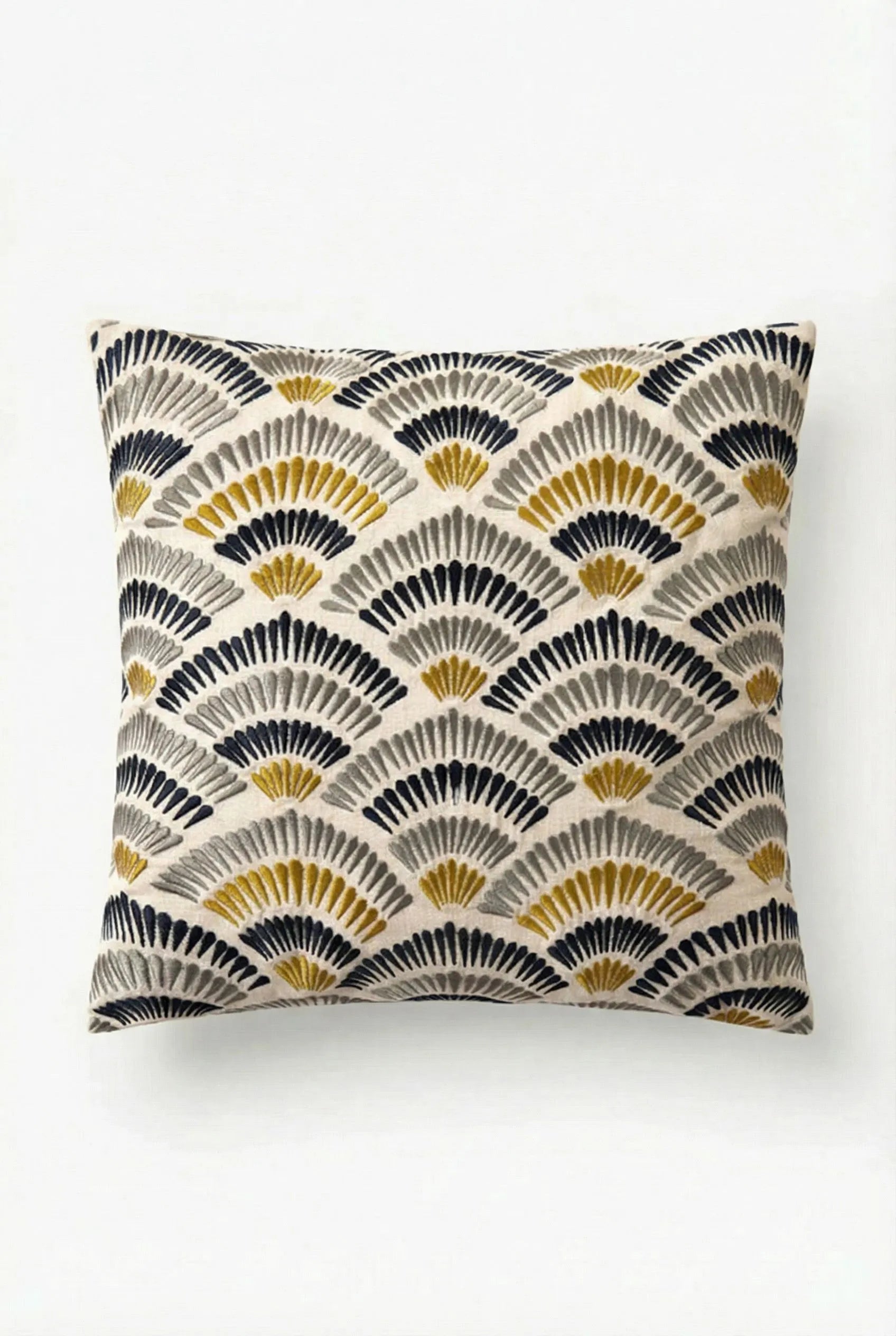 The Pasadena Embroidered Square Pillow features an art deco fan pattern in black, gold, and gray on a cream background, covering the entire front for a stylish accent.