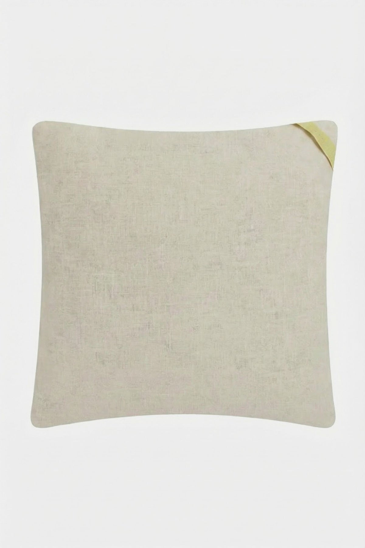 The Shanghai Links Embroidered Throw Pillow is a light beige square cushion with subtle texture and a small yellow fabric loop at one corner, shown against a white background.