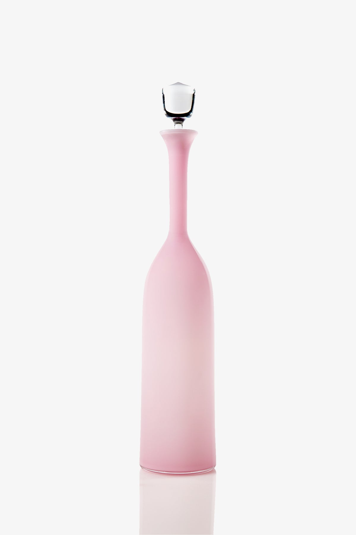 The Wexler Tall Bottle, an elegant frosted pink glass vessel with a long neck and a white stopper, is displayed against a plain white background.