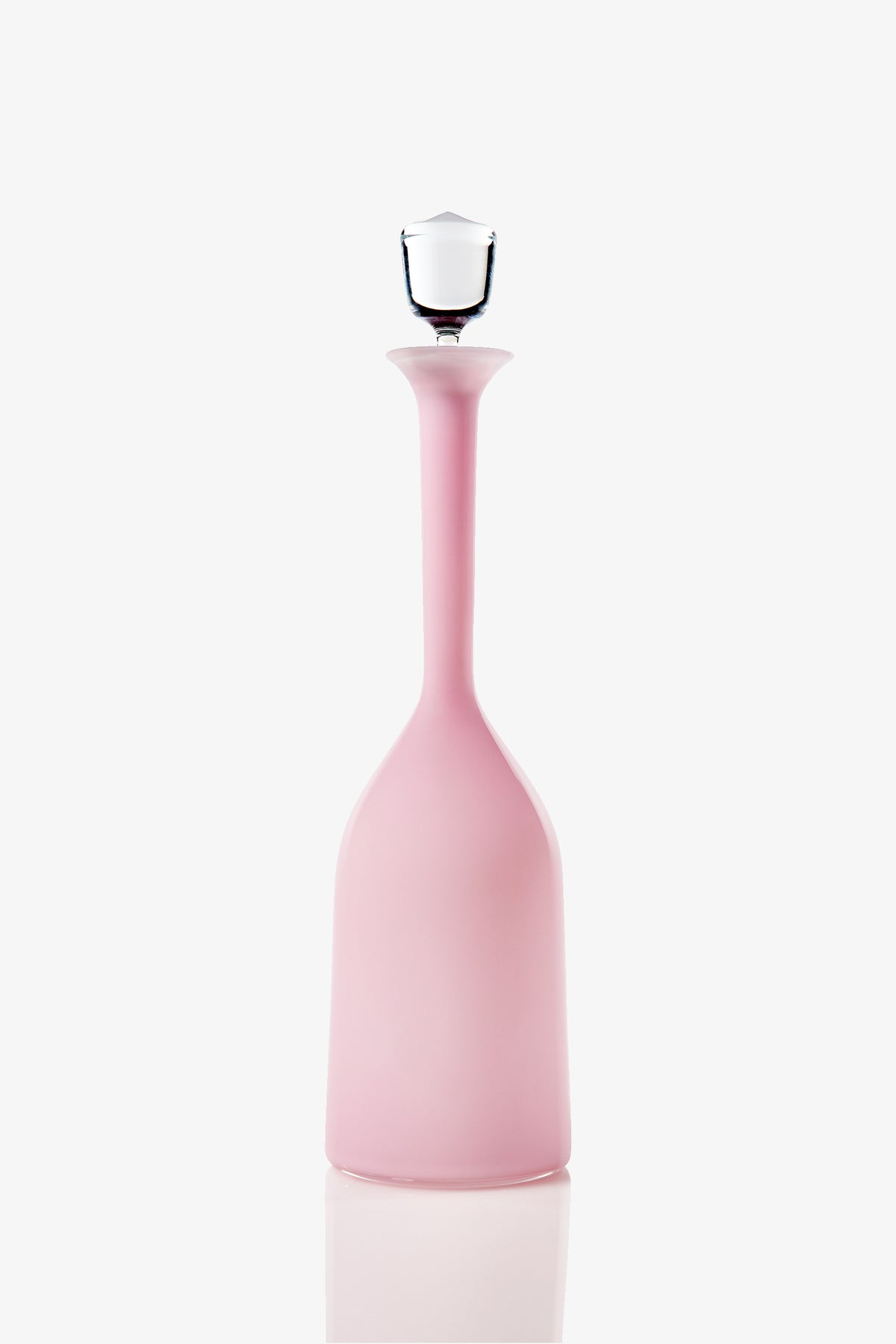 The Wexler Wide Bottle, a tall and slender pink glass vessel with a narrow neck and a clear glass stopper, is displayed against a white background.