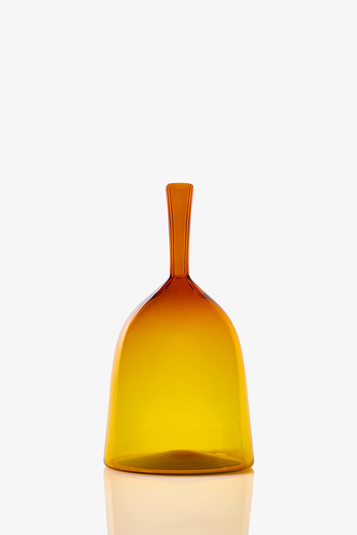The Wide Angelic Bottle is a translucent amber glass piece with a smooth, simple shape and a short, narrow handle, showcased against a plain white background.