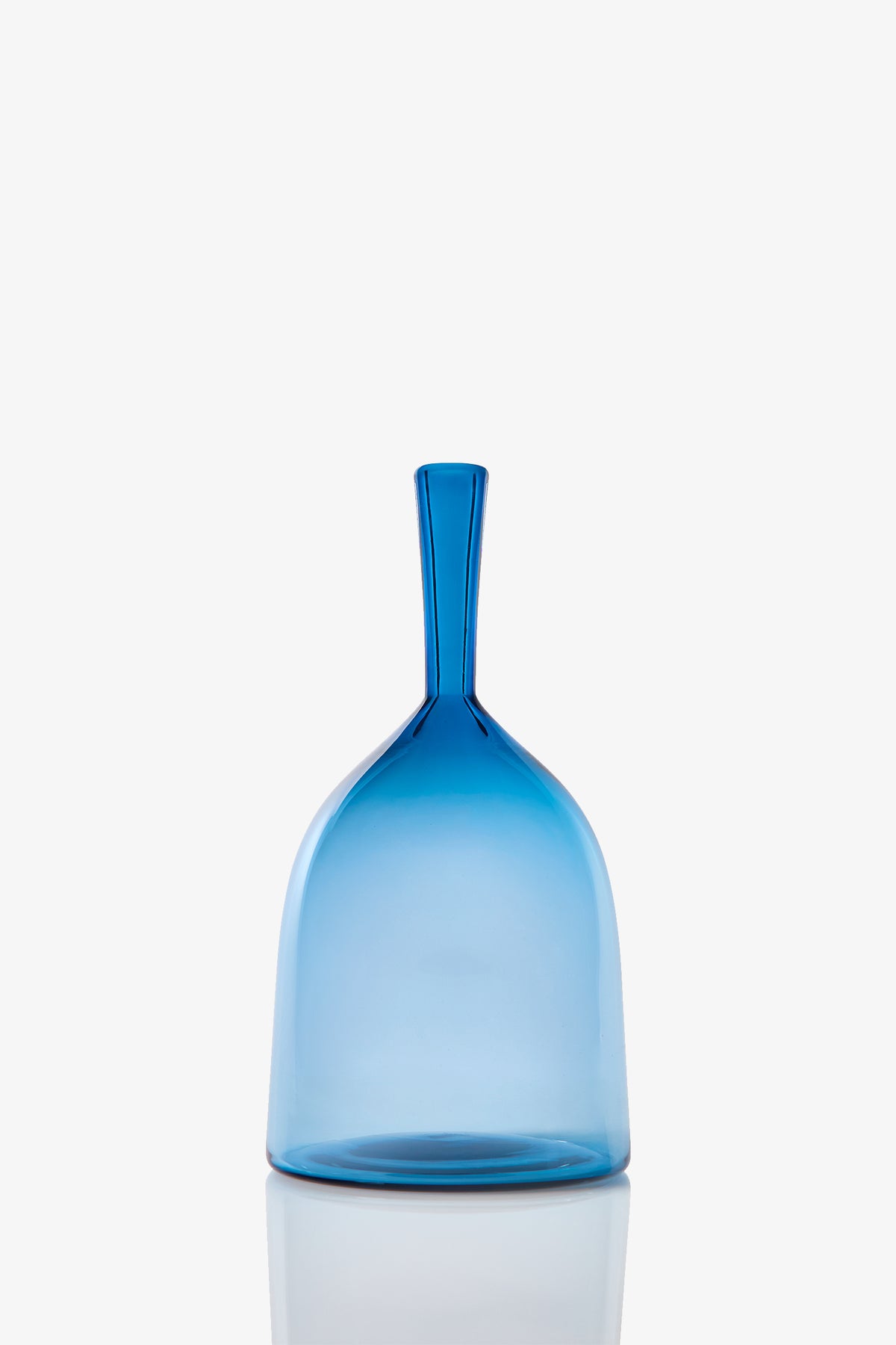 The Wide Angelic Bottle is a translucent blue glass vessel featuring a dome-shaped body and a narrow, elongated neck, shown against a plain white background.