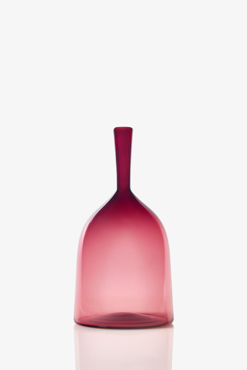 The Wide Angelic Bottle is a translucent pink glass jar featuring a wide body and smooth curves, displayed against a white background.
