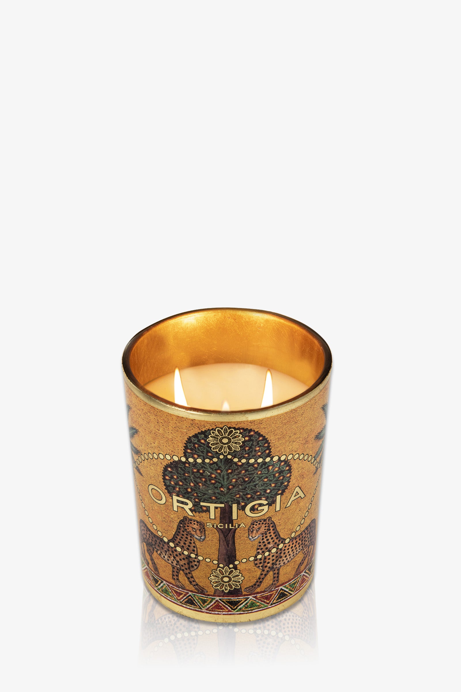 The Ortigia Large Candle comes in a decorative golden glass holder with intricate patterns, stylized animals, ornate details, and the ORTIGIA logo on the front.
