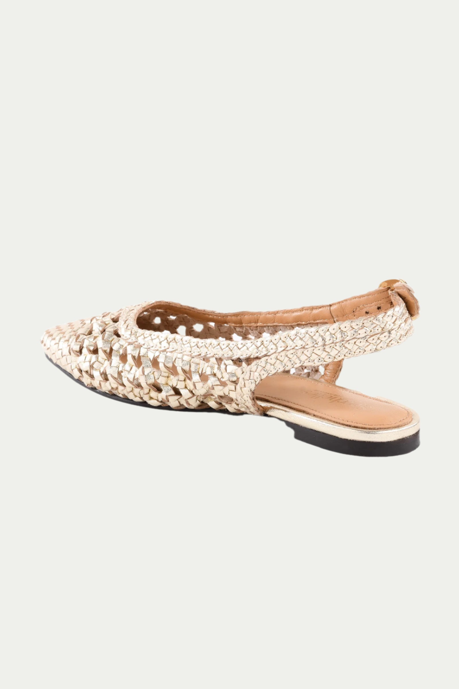 The Avalon Slingback - Gold Leather is a pointed toe flat with a woven design, open sides, cut-outs, and a low black sole.