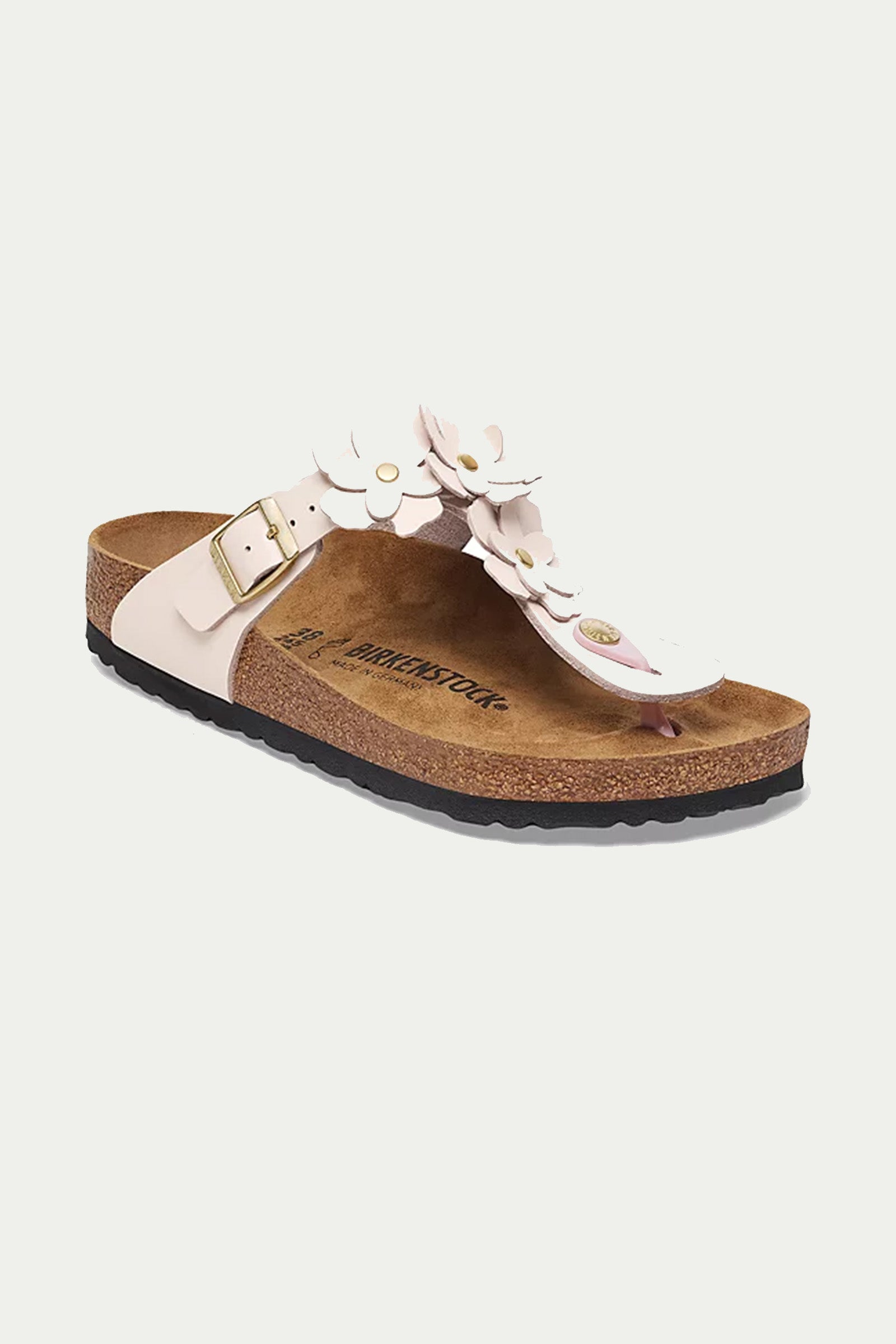 The Womens Gizeh Flowers Leather Sandal in Gizeh Rose features pink leather straps with a gold buckle, three flower cutouts, a cork sole, black textured outsole, and Birkenstock branding on the footbed.