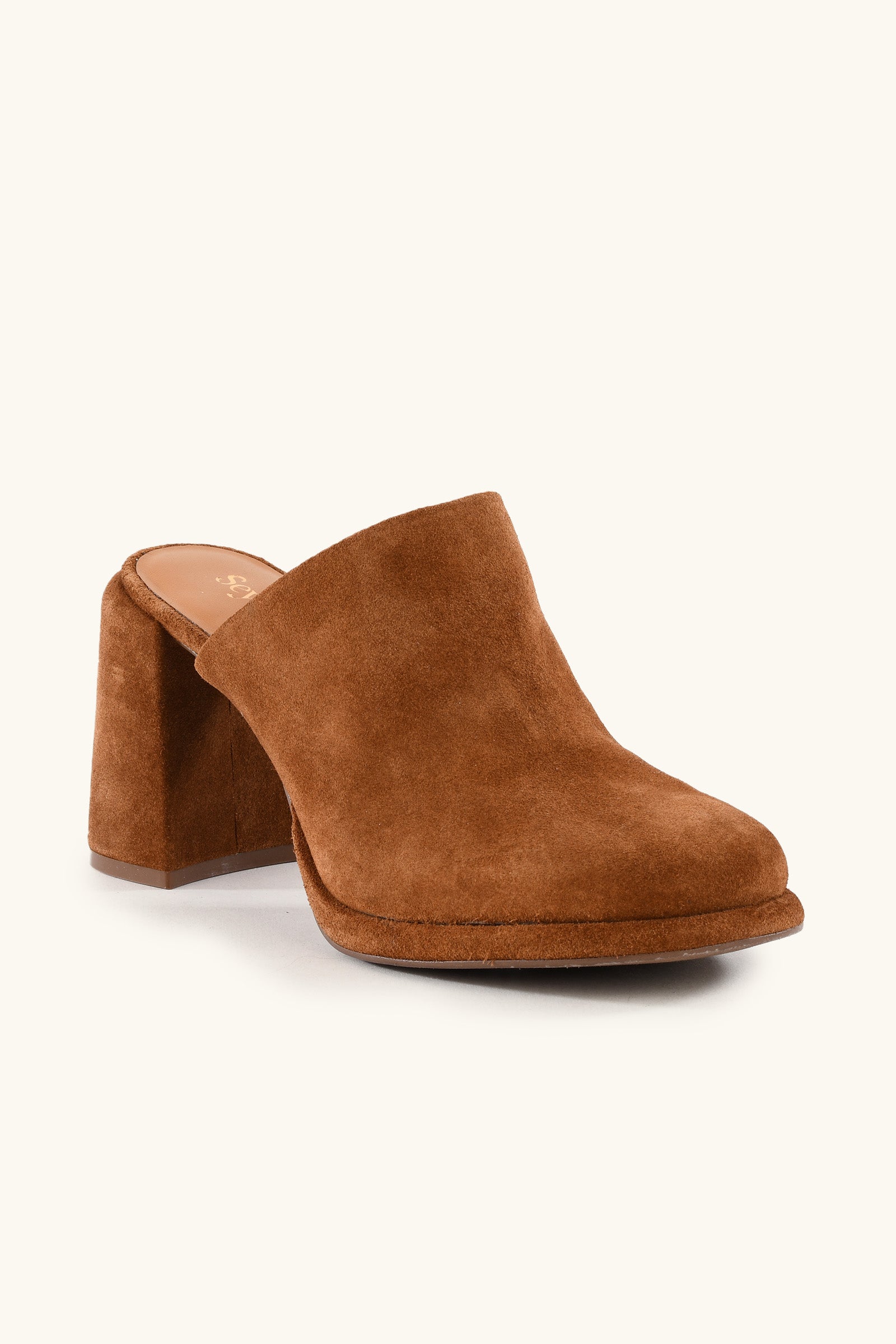 The Honor Mule - Brown Suede features a closed toe, thick block heel, minimalist slip-on design, and a slightly raised platform.