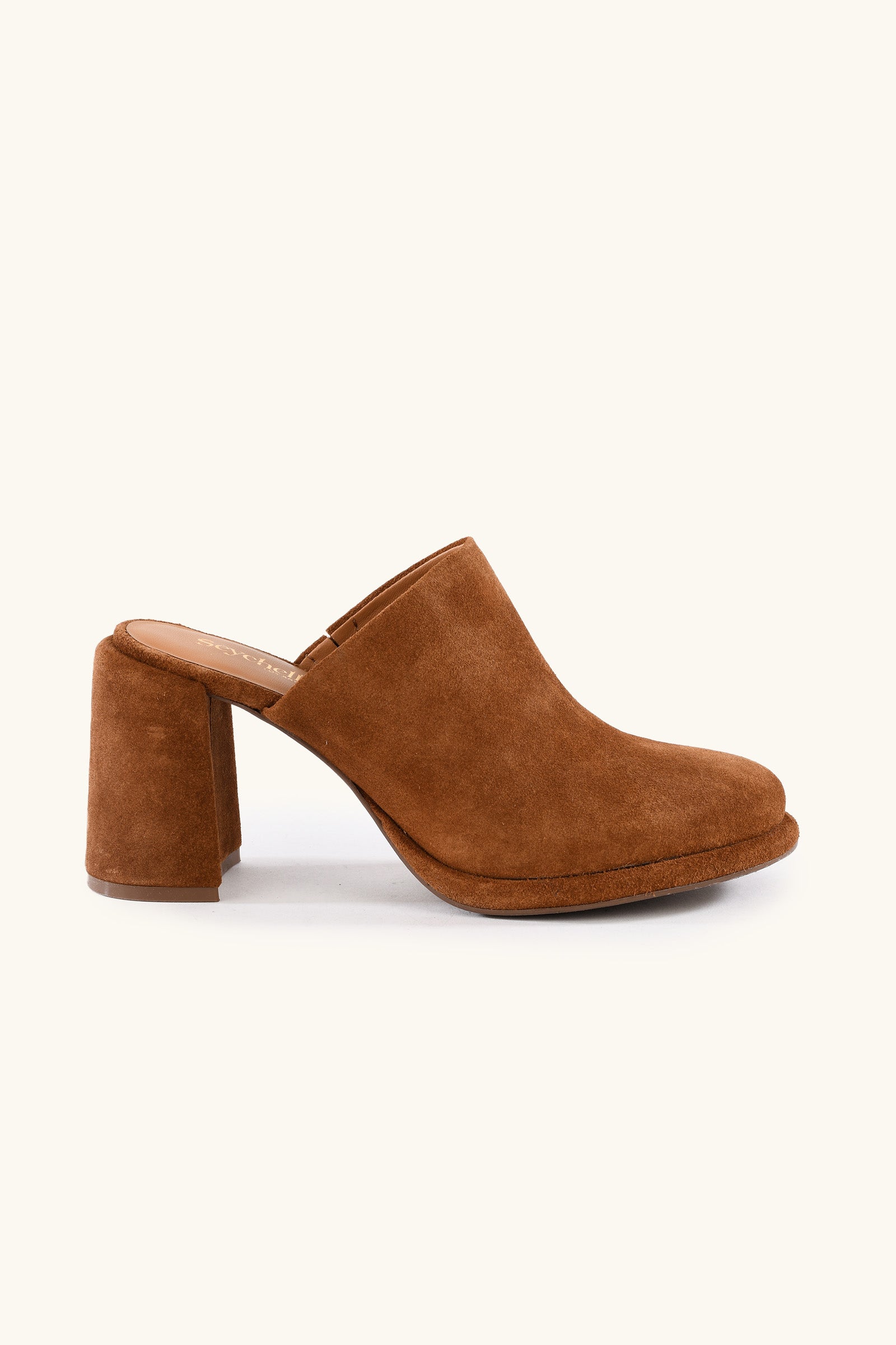 The Honor Mule - Brown Suede features a closed toe, open back, and chunky high heel in BROWN suede, displayed on a plain light background.