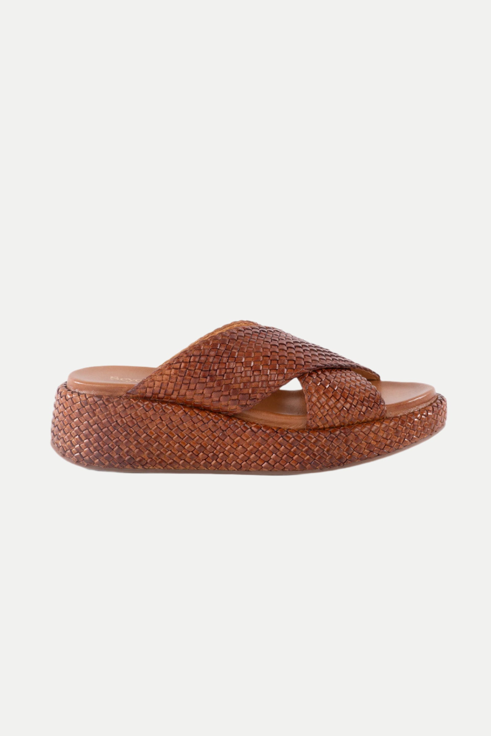 The Key West Woven Leather Platform Slide Sandals in tan feature crisscross woven straps and a textured sole, displayed from the side on a white background.