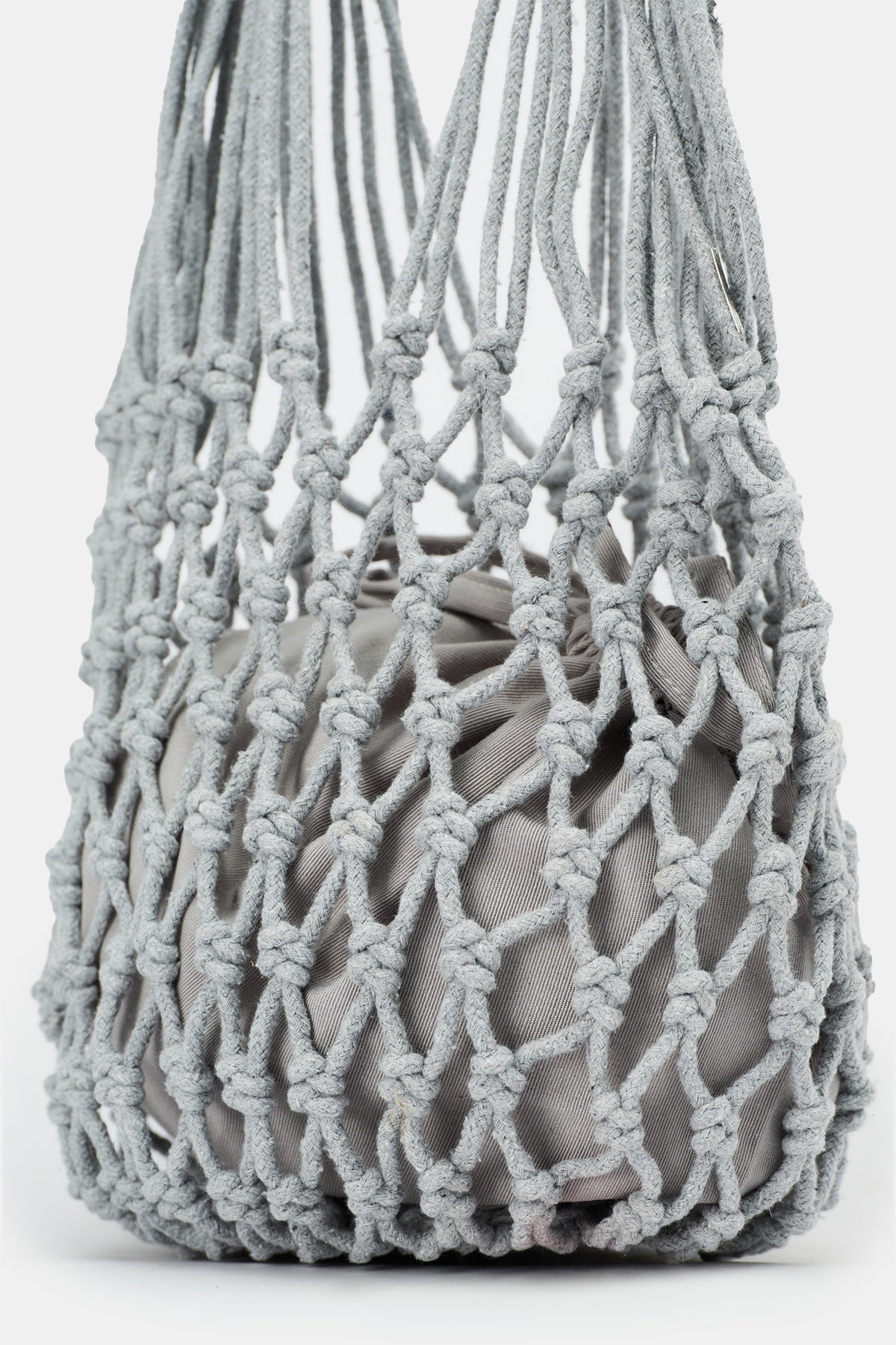 Of course! Please provide the keywords you'd like me to blend into the description for the NANNACAY KIM WOVEN BAG.