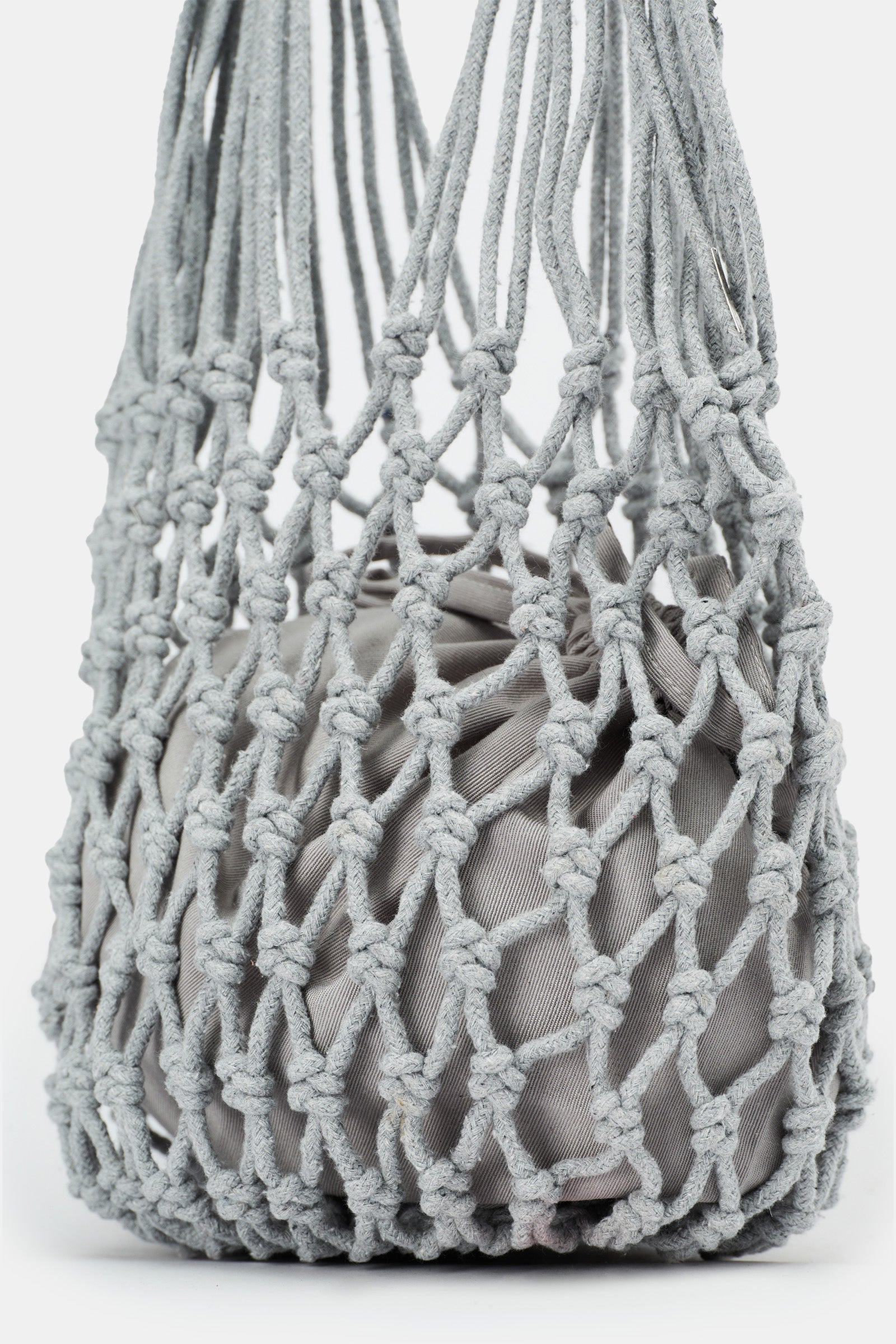 Of course! Please provide the keywords you'd like me to blend into the description for the NANNACAY KIM WOVEN BAG.