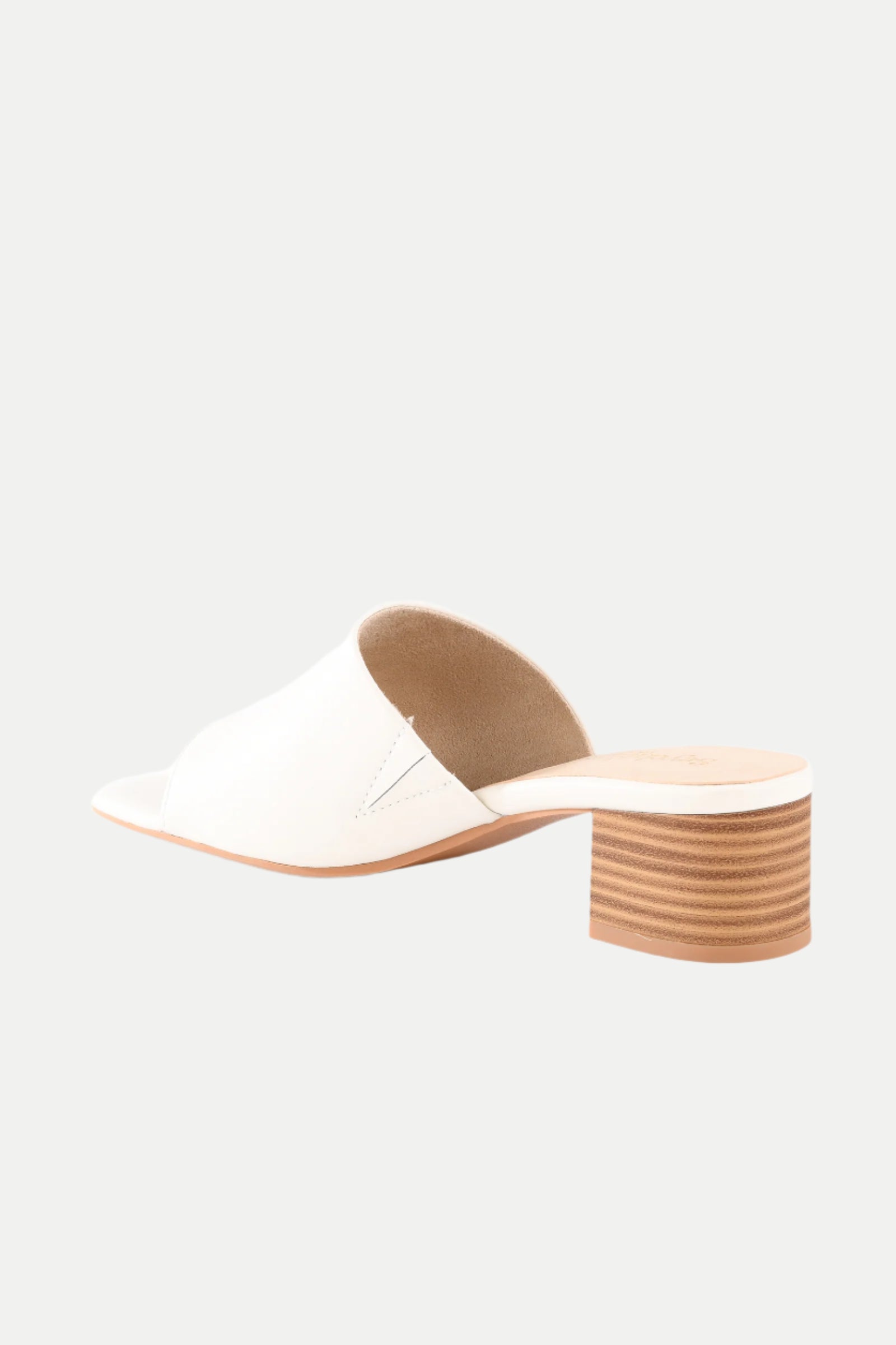 The Pepper White Leather Heeled Mule Sandal features a white open-toe design, low stacked wooden block heel, and slip-on style, displayed on a plain light background.