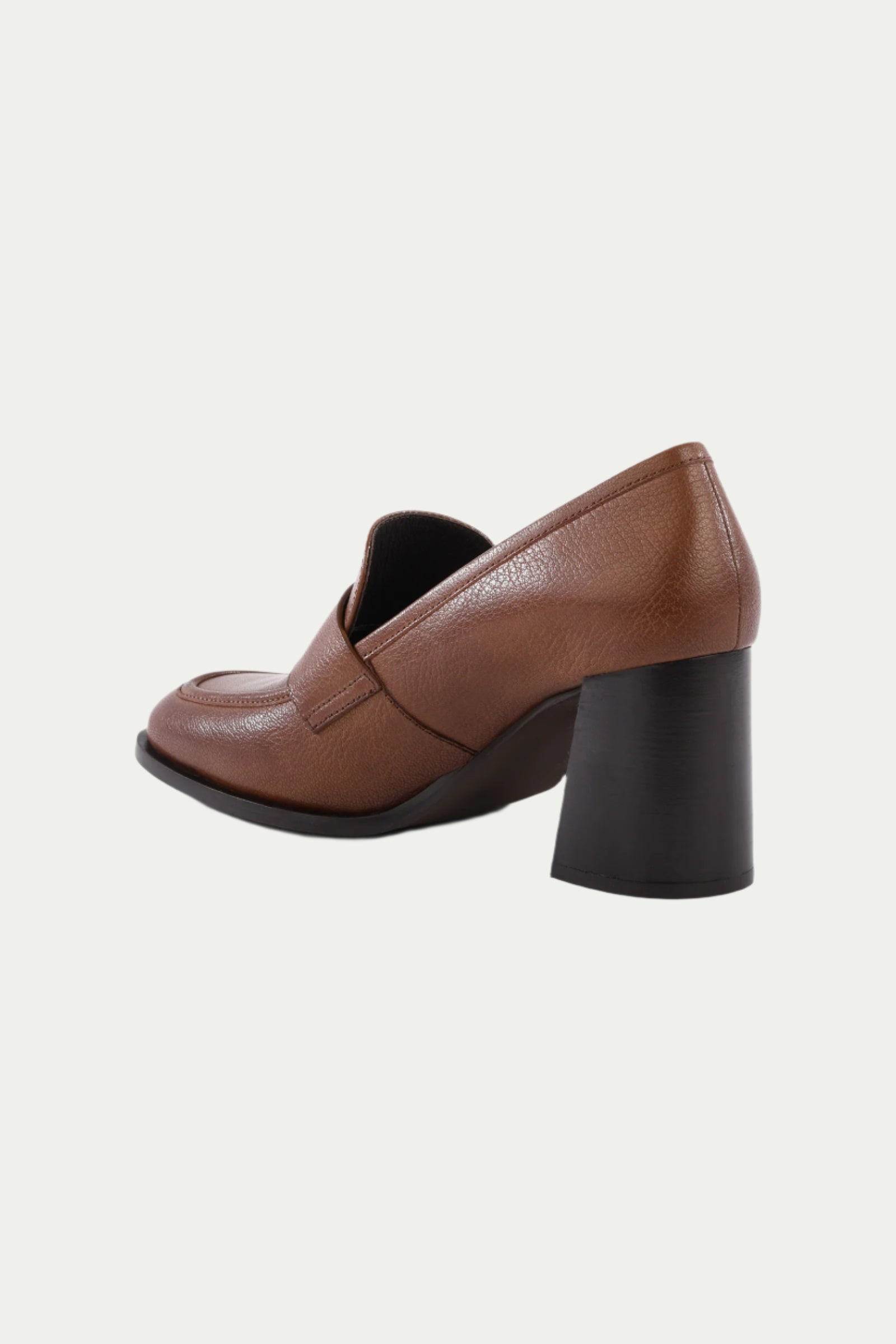 The Run The World Brown Leather Heeled Loafer features brown leather, a chunky high black heel, rounded toe, and cushioned insole for comfort, displayed on a plain white background.