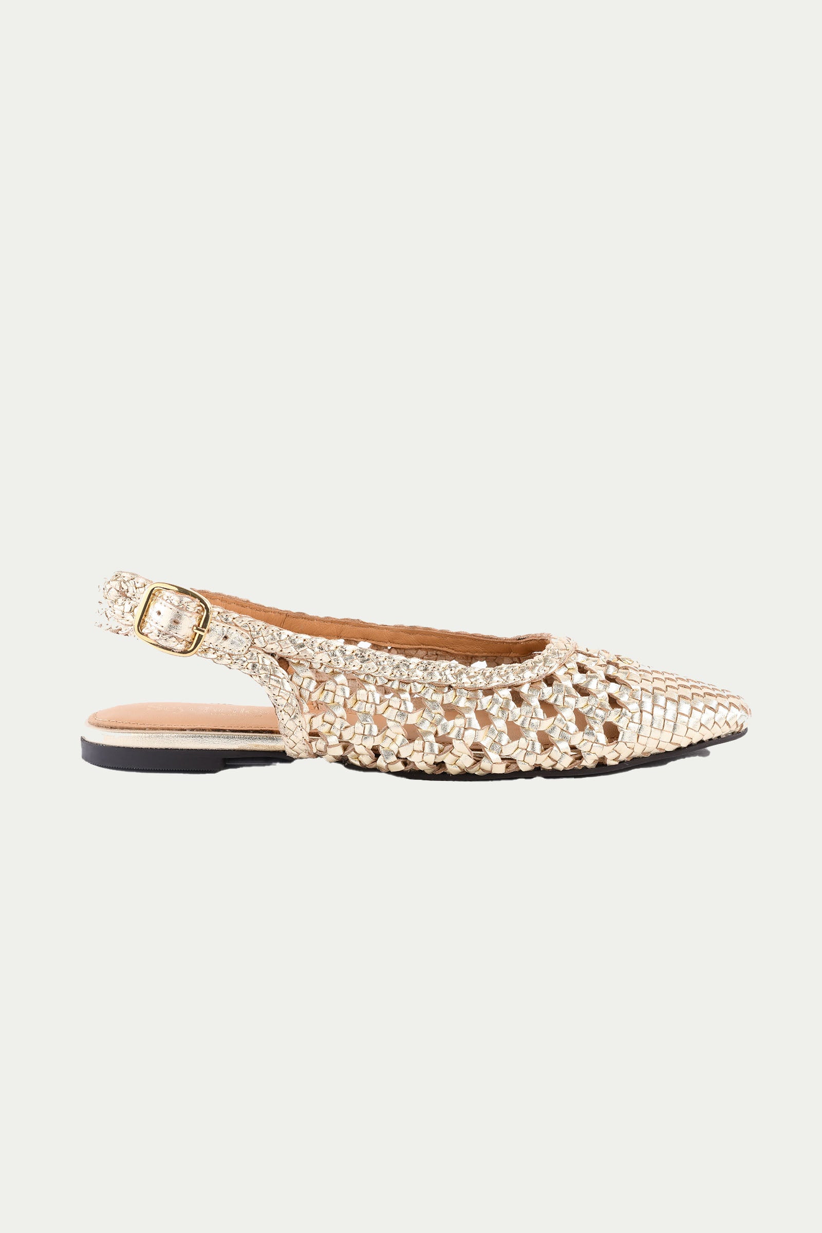 The Avalon Slingback - Gold Leather is a pointed-toe flat in gold with woven texture, open sides, a small buckle strap at the heel, and a low black sole.