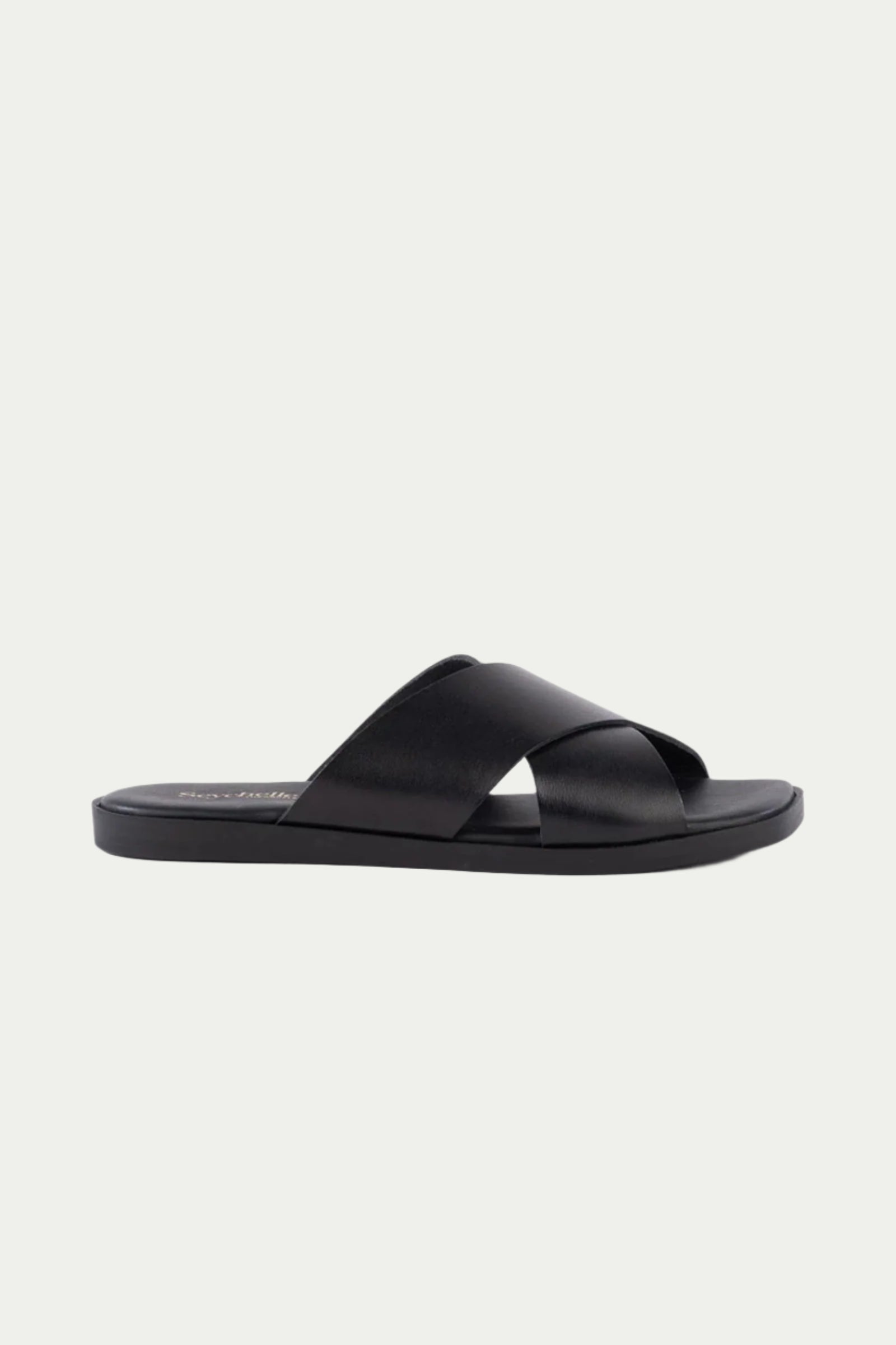 The Chai Sandal - Black Leather features two wide, crisscross straps and an open toe, shown in black against a plain white background.